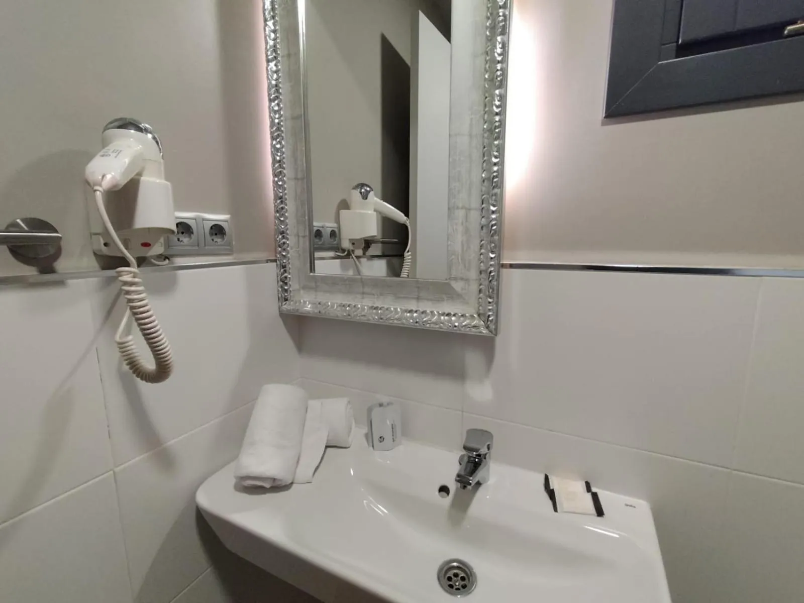 Bathroom in Montserrat Apartments by gaiarooms