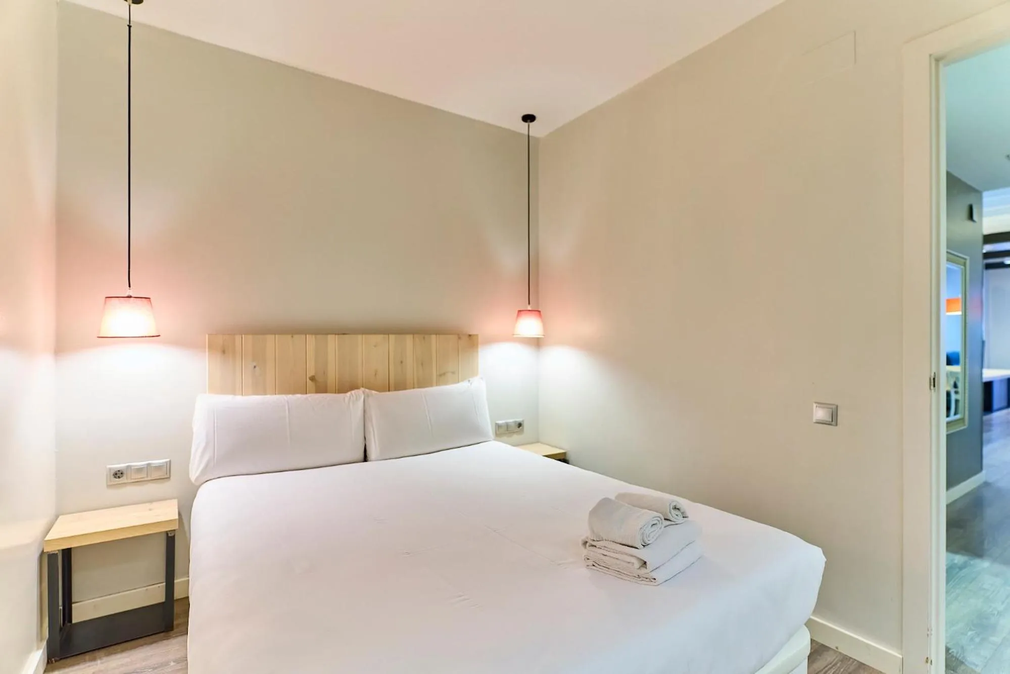 Bed in Montserrat Apartments by gaiarooms