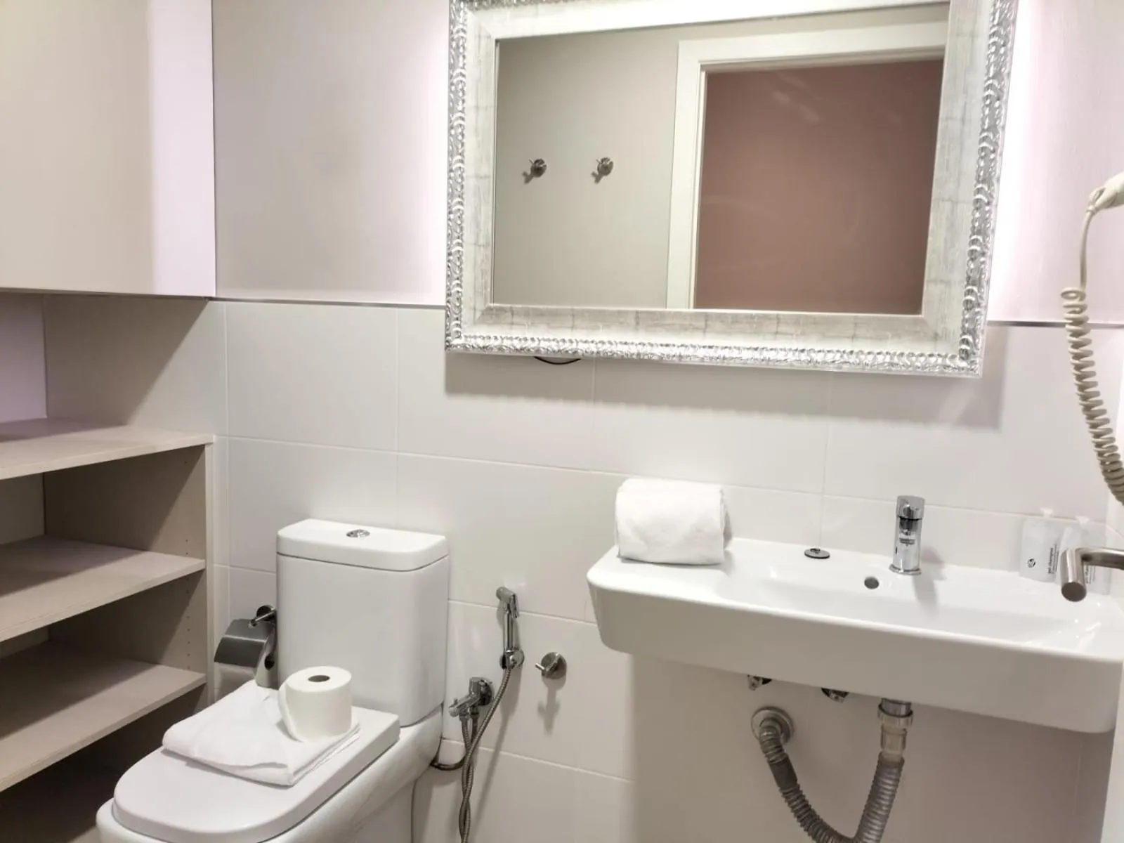 Bathroom in Montserrat Apartments by gaiarooms