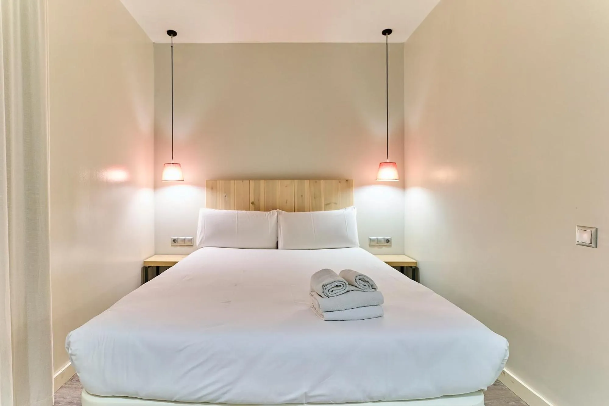 Bed in Montserrat Apartments by gaiarooms