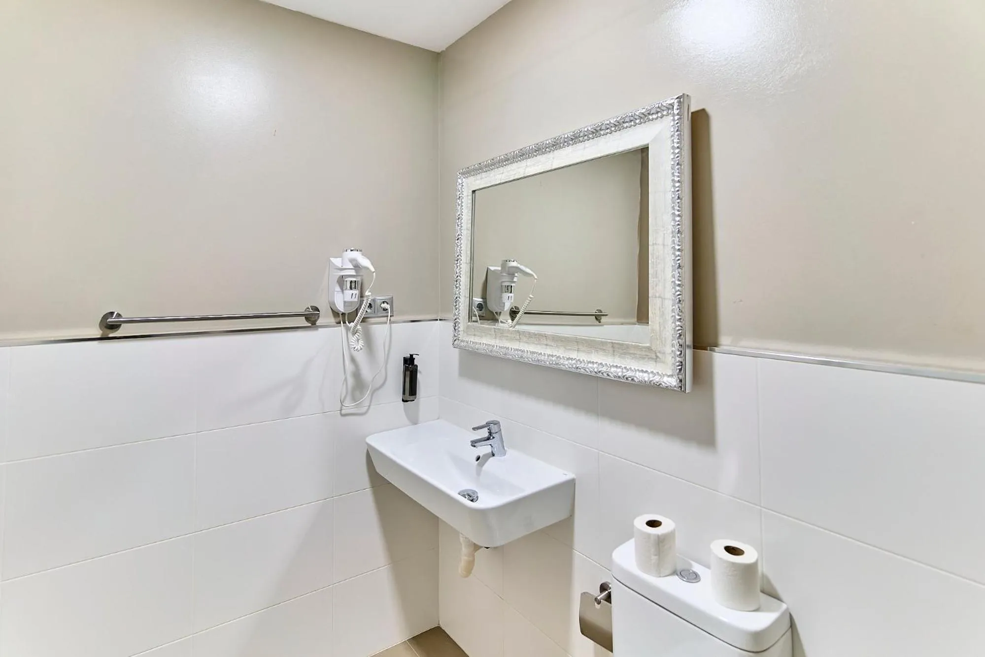 Toilet in Montserrat Apartments by gaiarooms