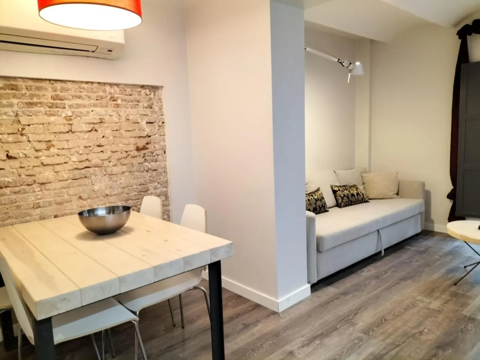 Living room, Bed in Montserrat Apartments by gaiarooms