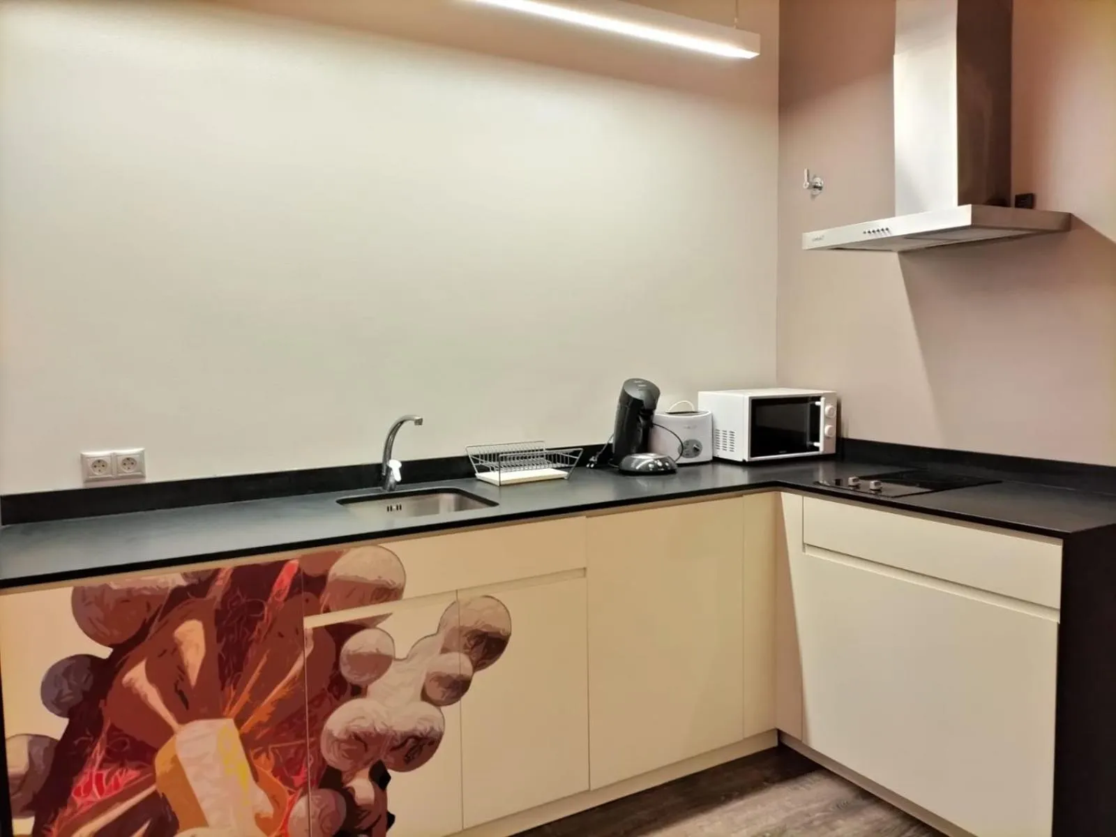 Communal kitchen in Montserrat Apartments by gaiarooms