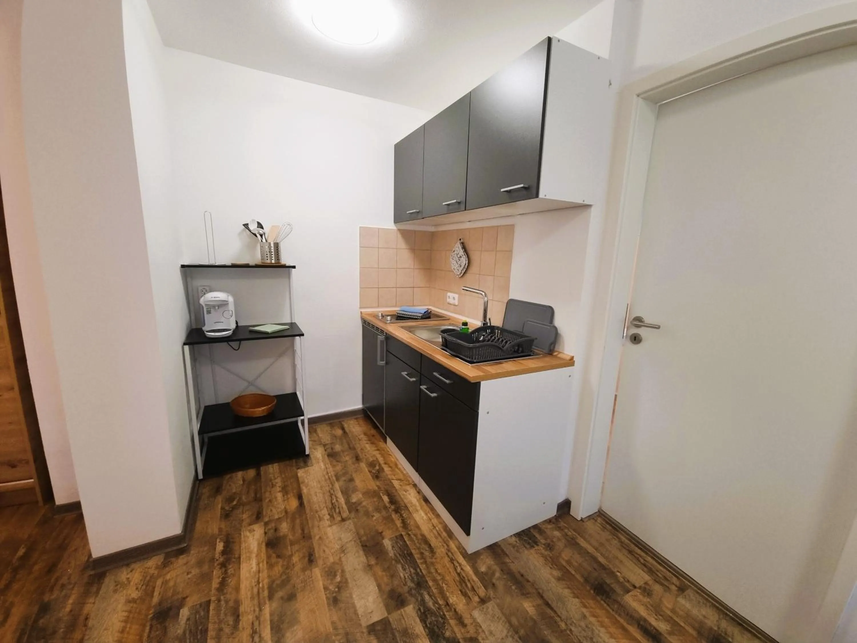 Kitchen or kitchenette in CJS Apartments - Chill or Drive am Nürburgring, new Box Spring Beds, new furniture, WLan, Spacious Rooms, Quiet Location