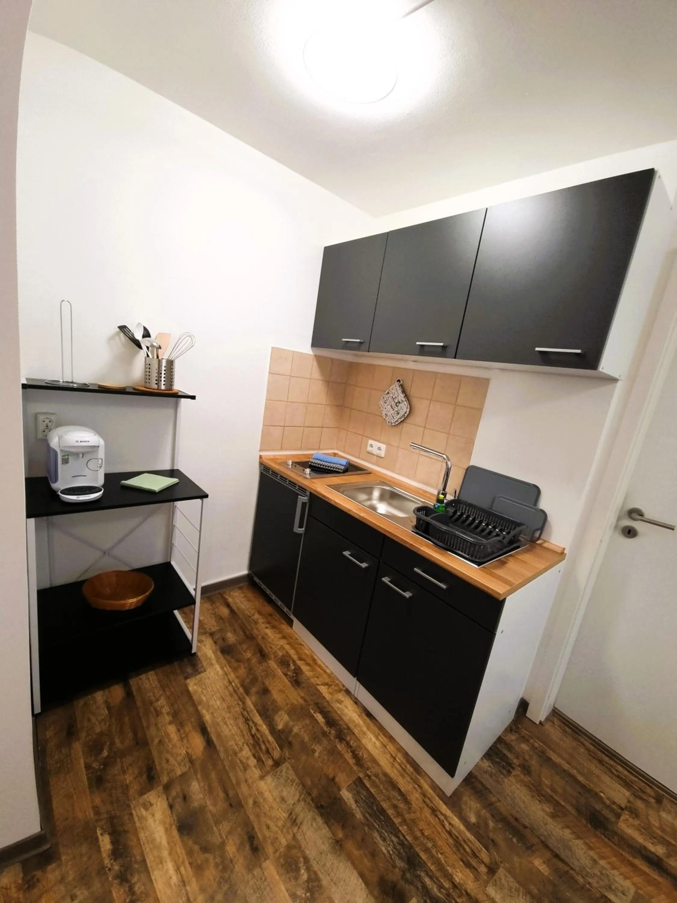 Kitchen or kitchenette in CJS Apartments - Chill or Drive am Nürburgring, new Box Spring Beds, new furniture, WLan, Spacious Rooms, Quiet Location