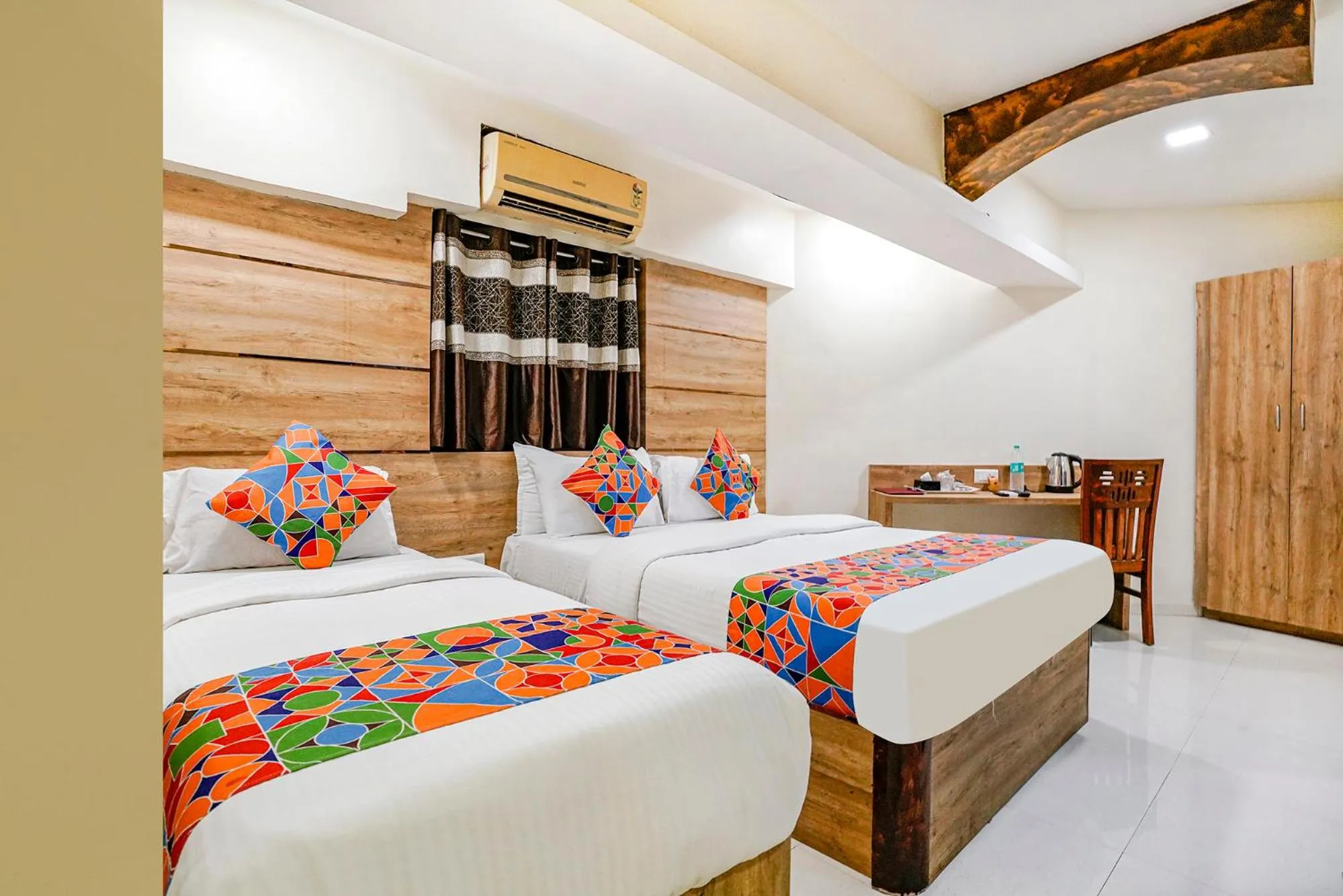 Bed in FabHotel Amber Corp Inn