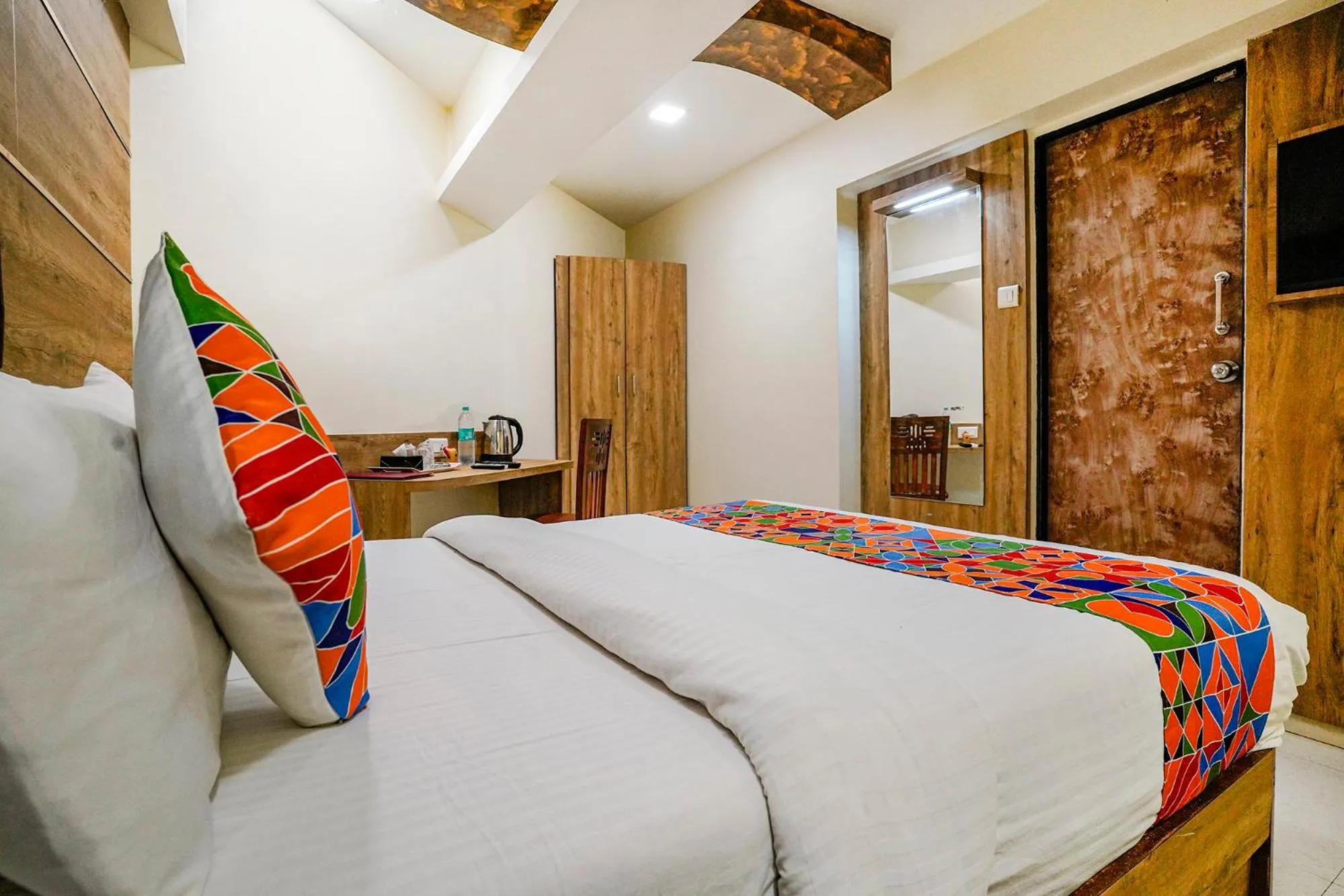 Bed in FabHotel Amber Corp Inn