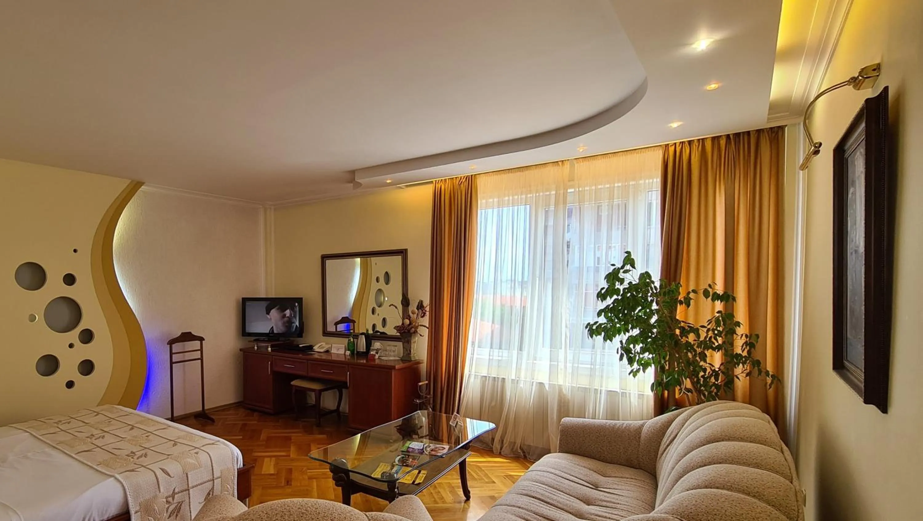 Communal lounge/ TV room, Bed in National Palace Wine & Spa Hotel