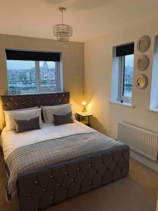 Bed in Luxury 2 Bedroom waterfront apartment with balcony