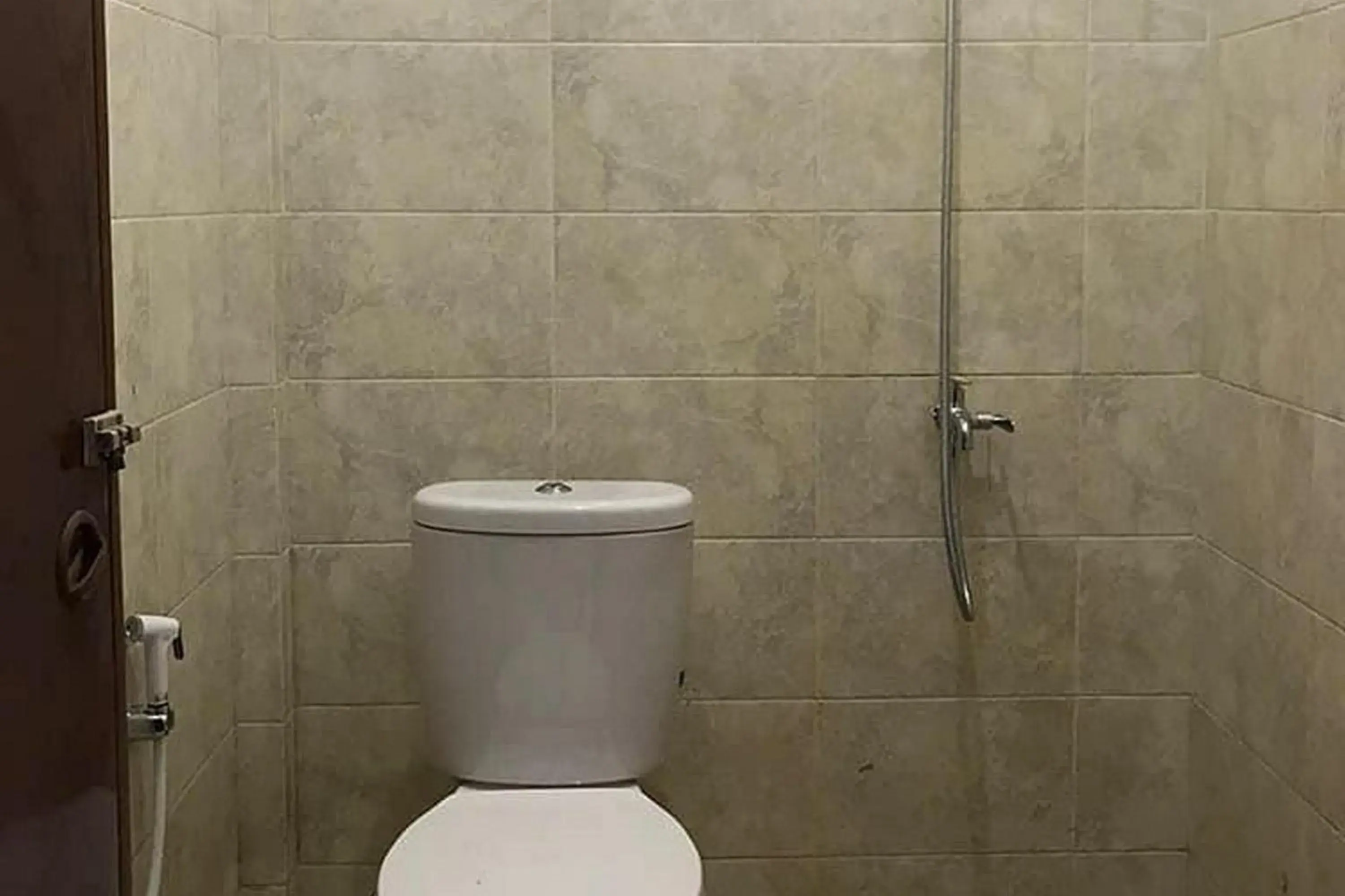 Bathroom in Marthine Residence Syariah RedPartner Bathroom in Marthine Residence Syariah RedPartner