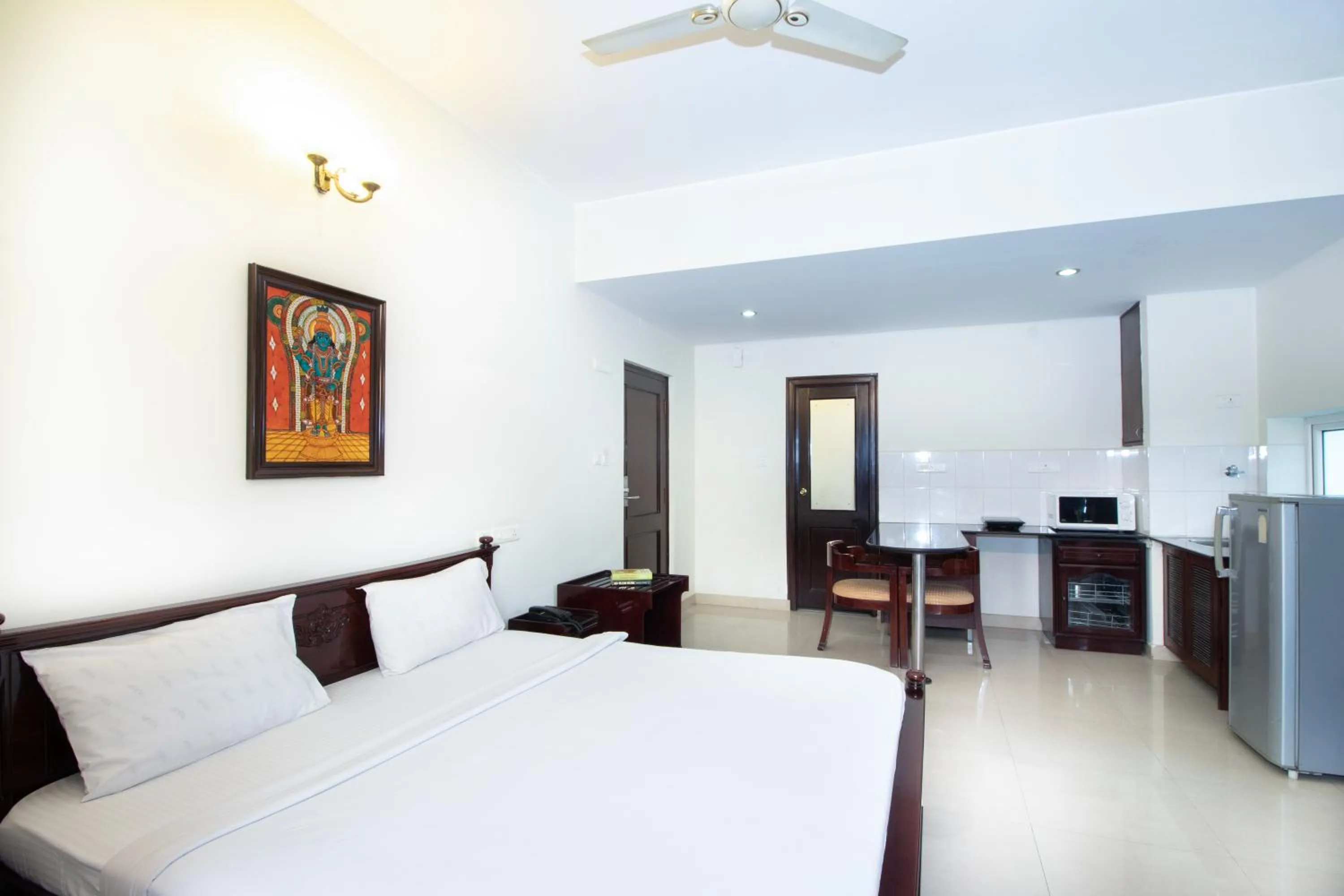 Photo of the whole room, Bed in Sanctum Suites Indiranagar Bangalore