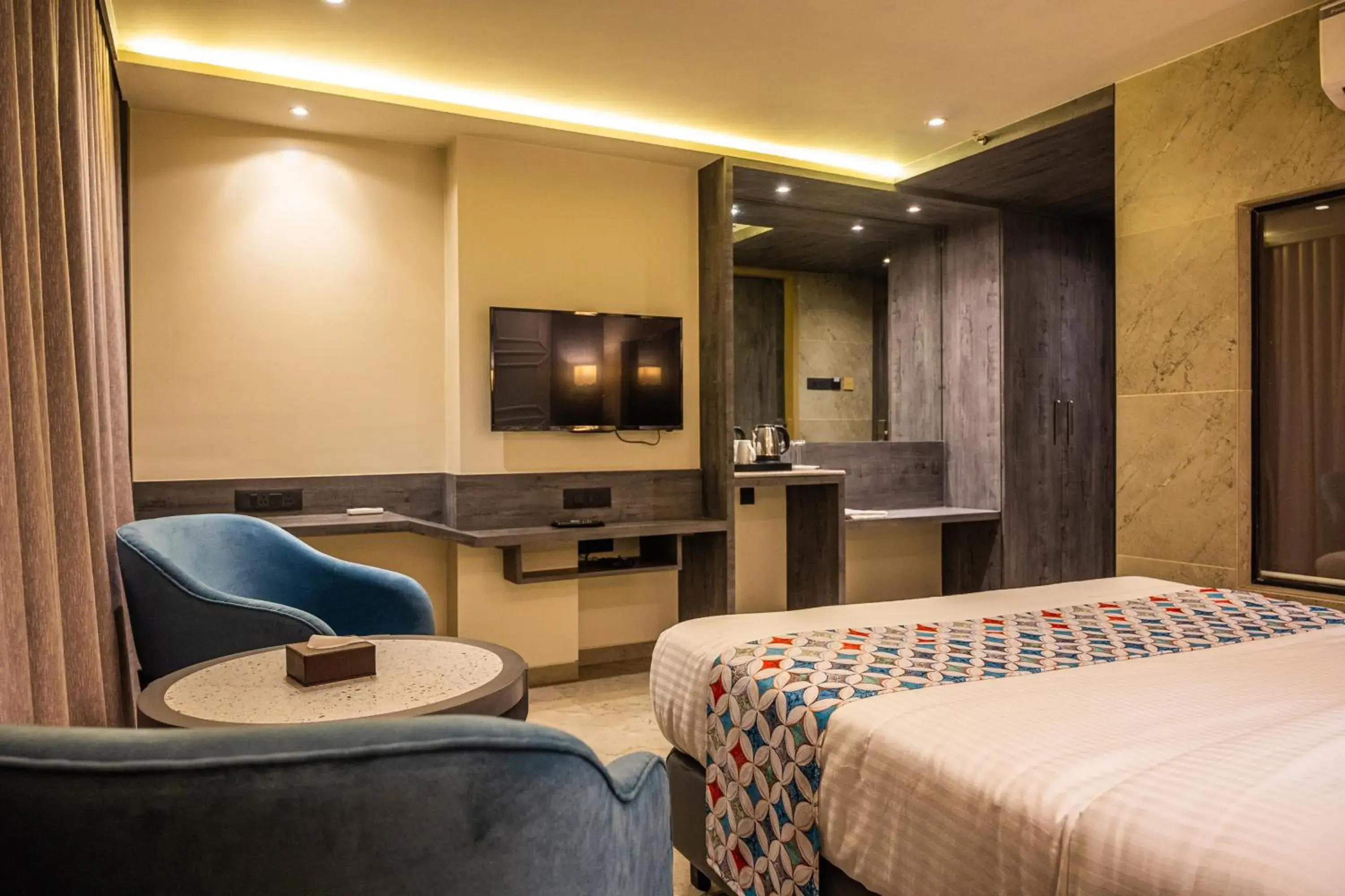 Photo of the whole room, Bed in Suvidha Suites Photo of the whole room, Bed in Suvidha Suites