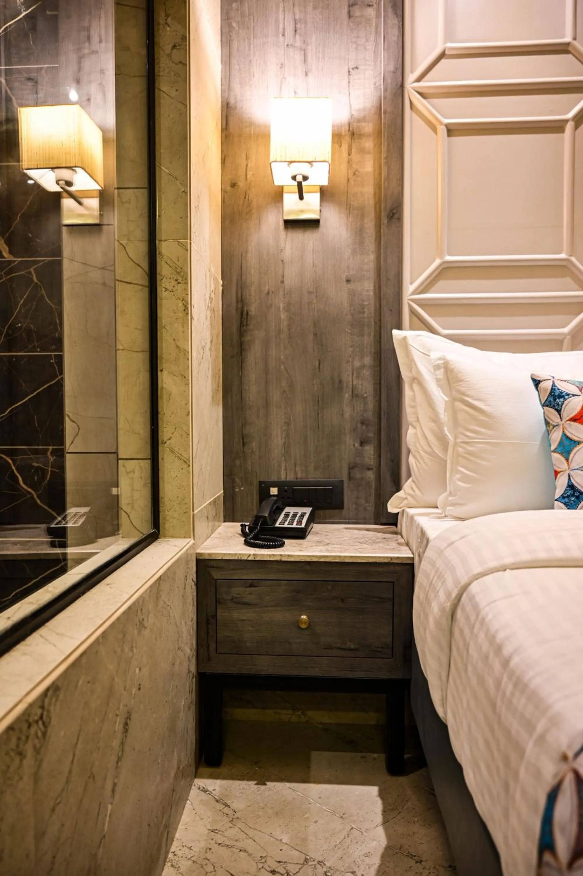 Bed in Suvidha Suites