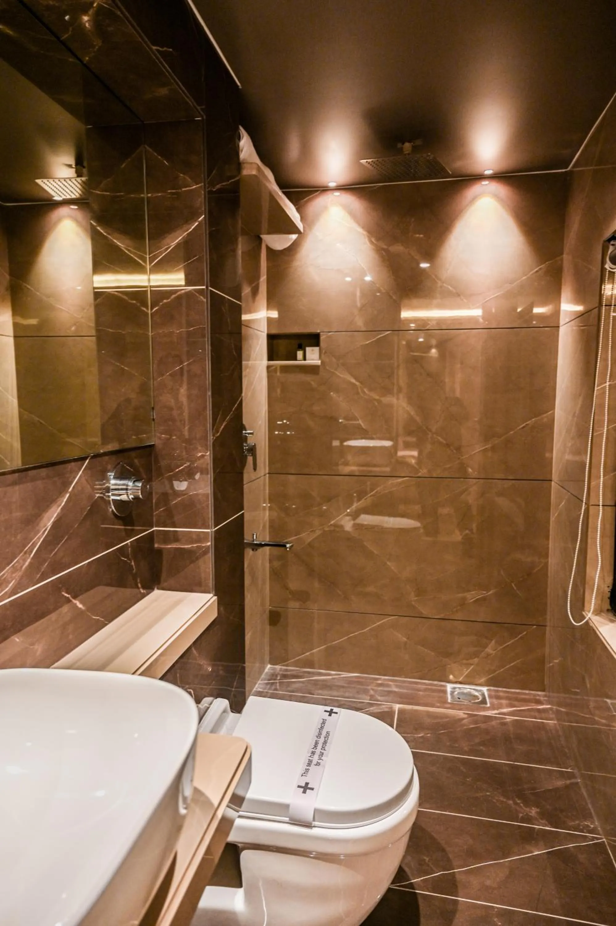 Bathroom in Suvidha Suites