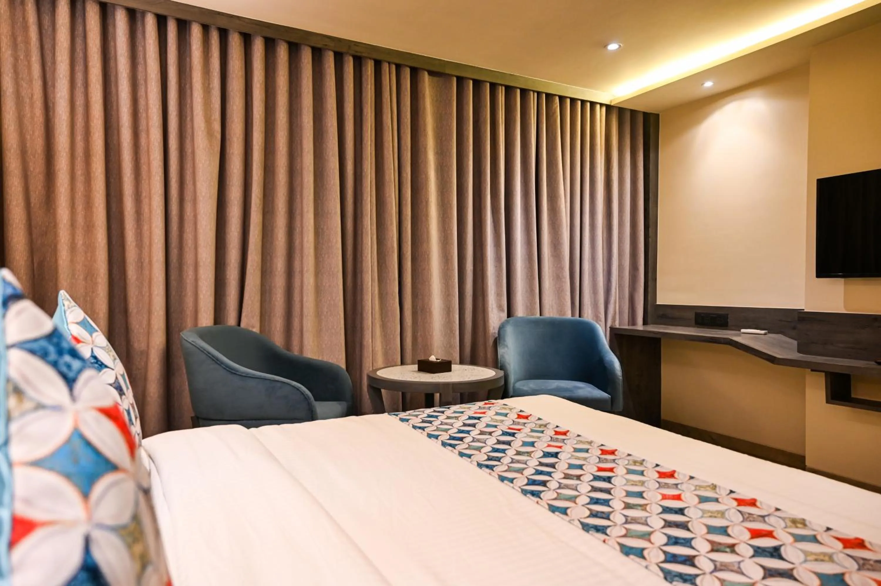 Photo of the whole room, Bed in Suvidha Suites