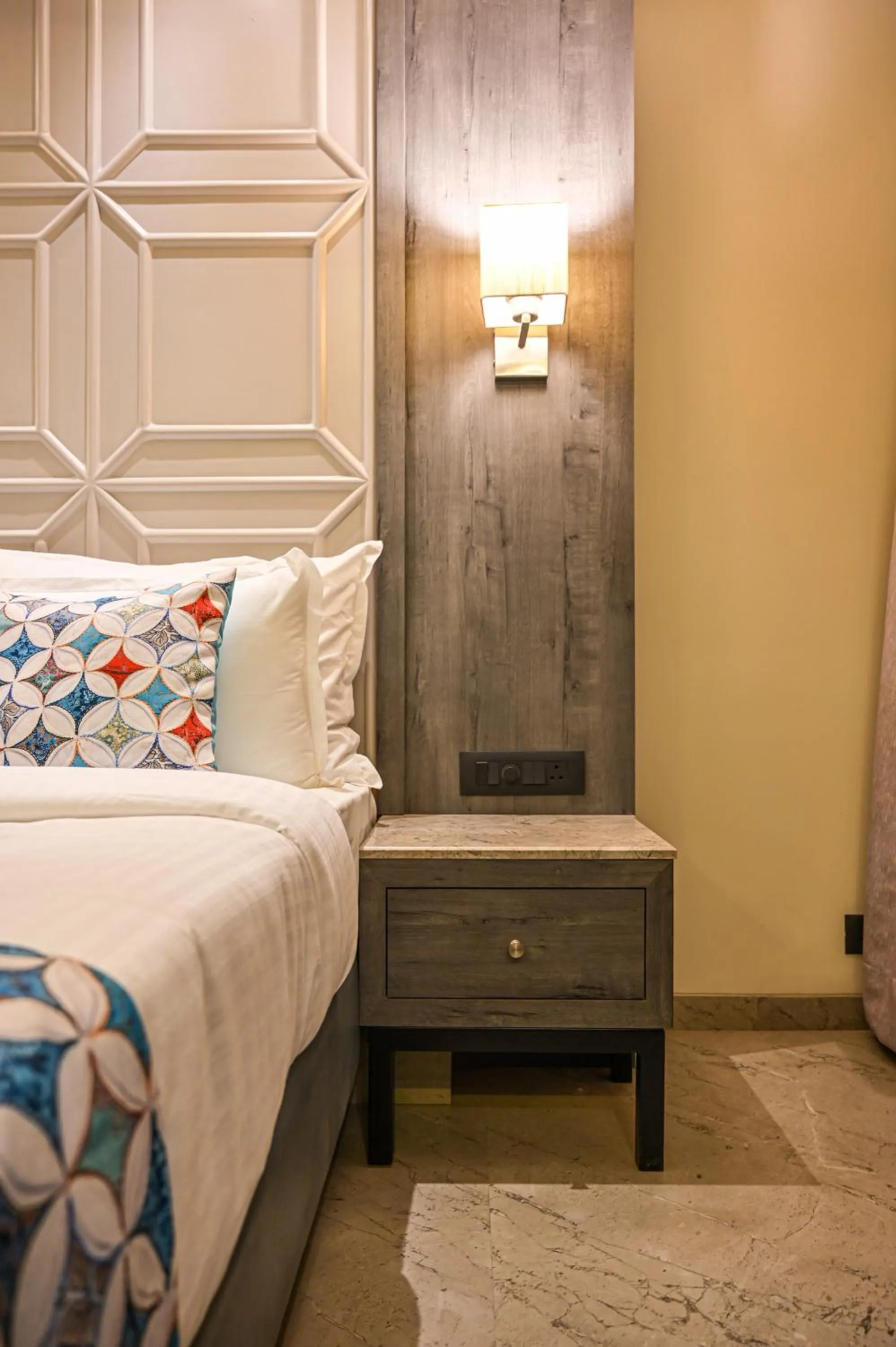 Bed in Suvidha Suites