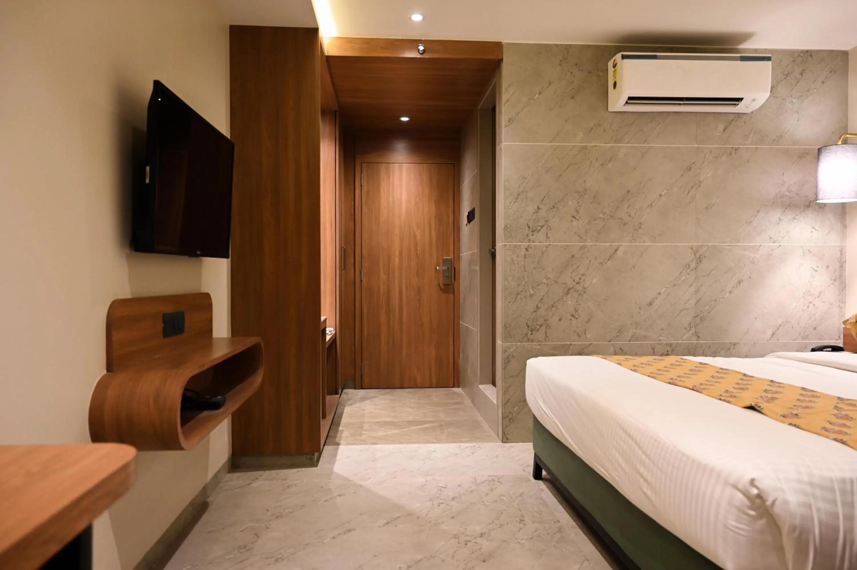 Photo of the whole room, Bed in Suvidha Suites