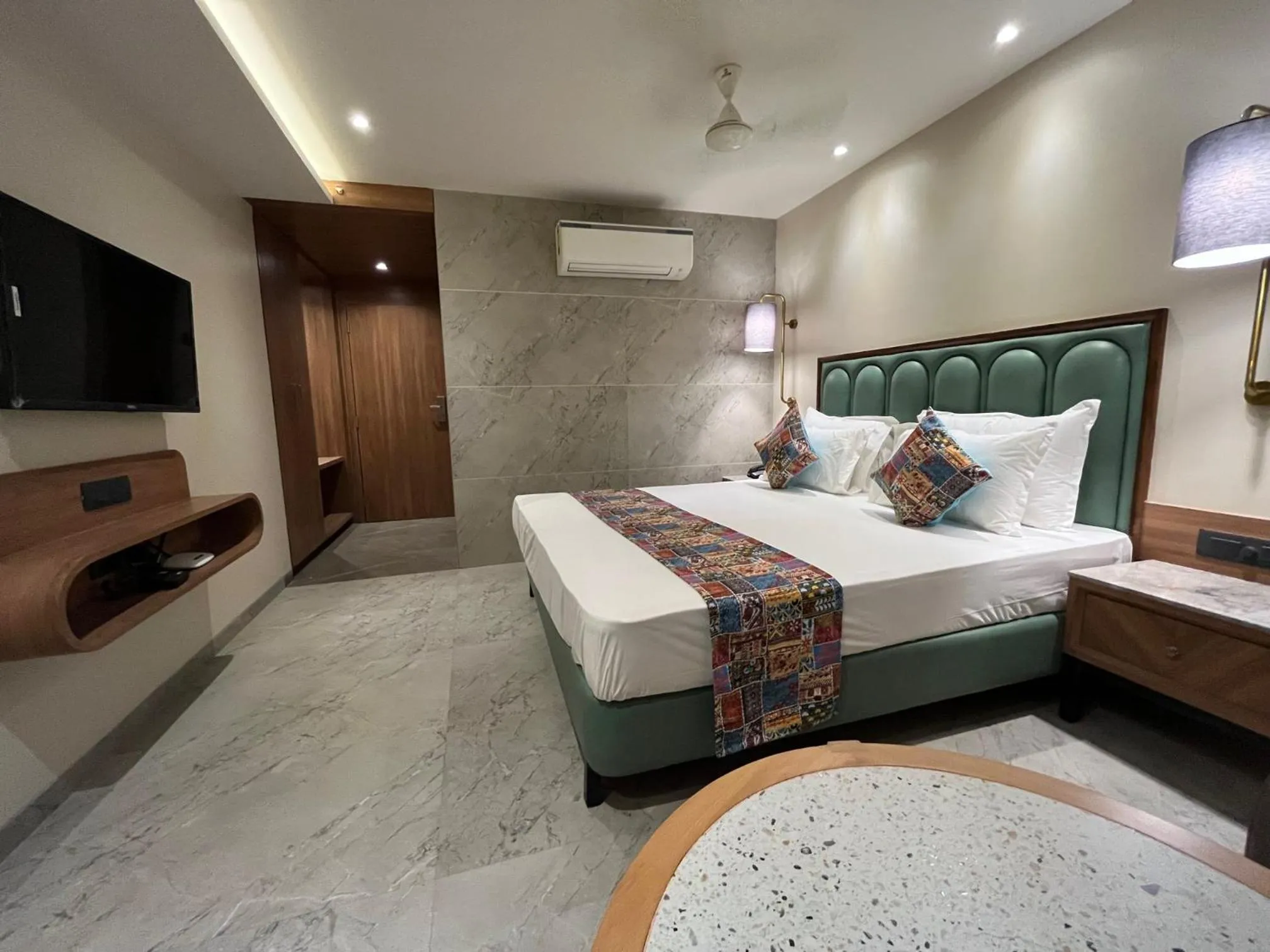 Photo of the whole room, Bed in Suvidha Suites