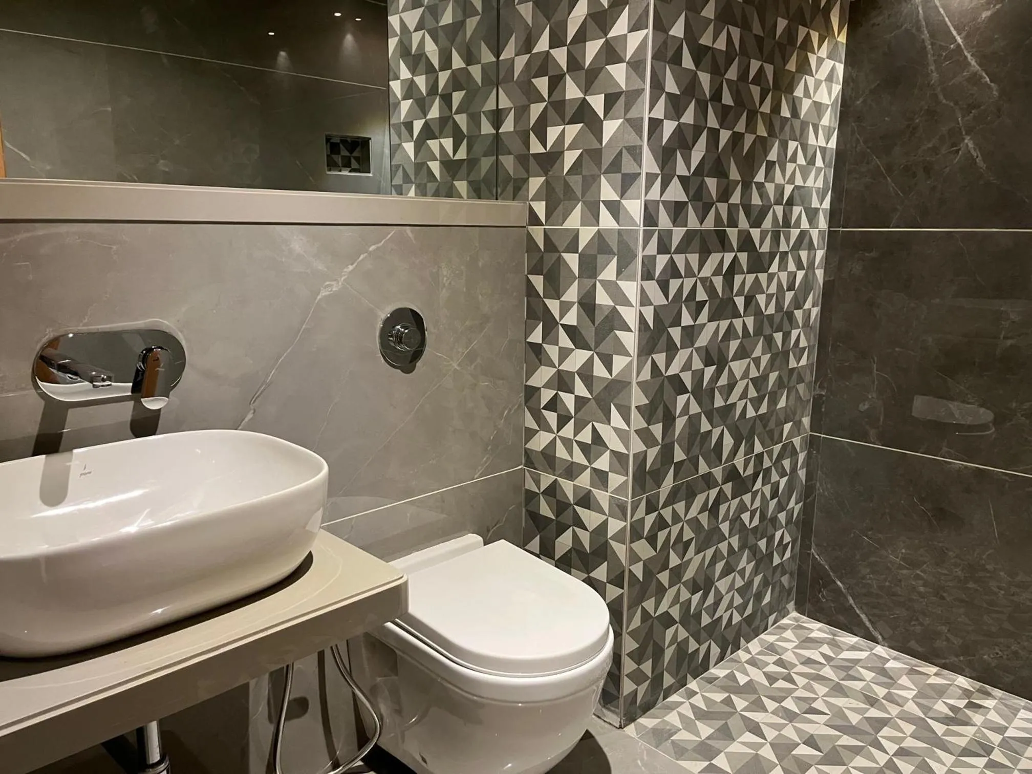 Bathroom in Suvidha Suites