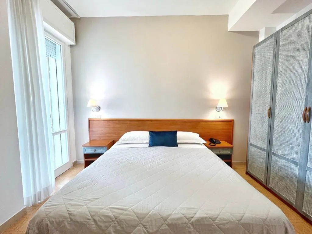 Photo of the whole room, Bed in Aura Living Hotel