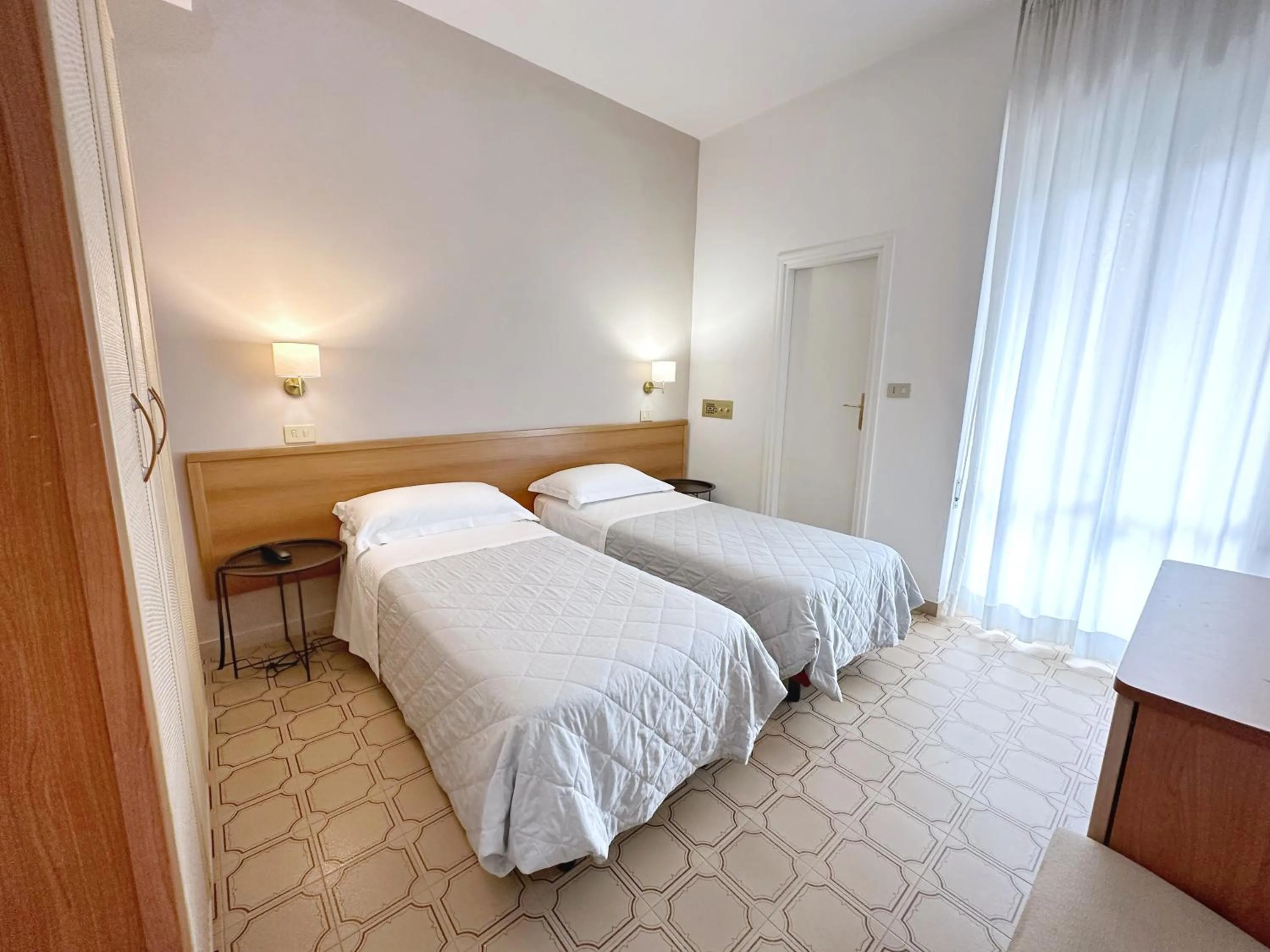 Bed in Aura Living Hotel