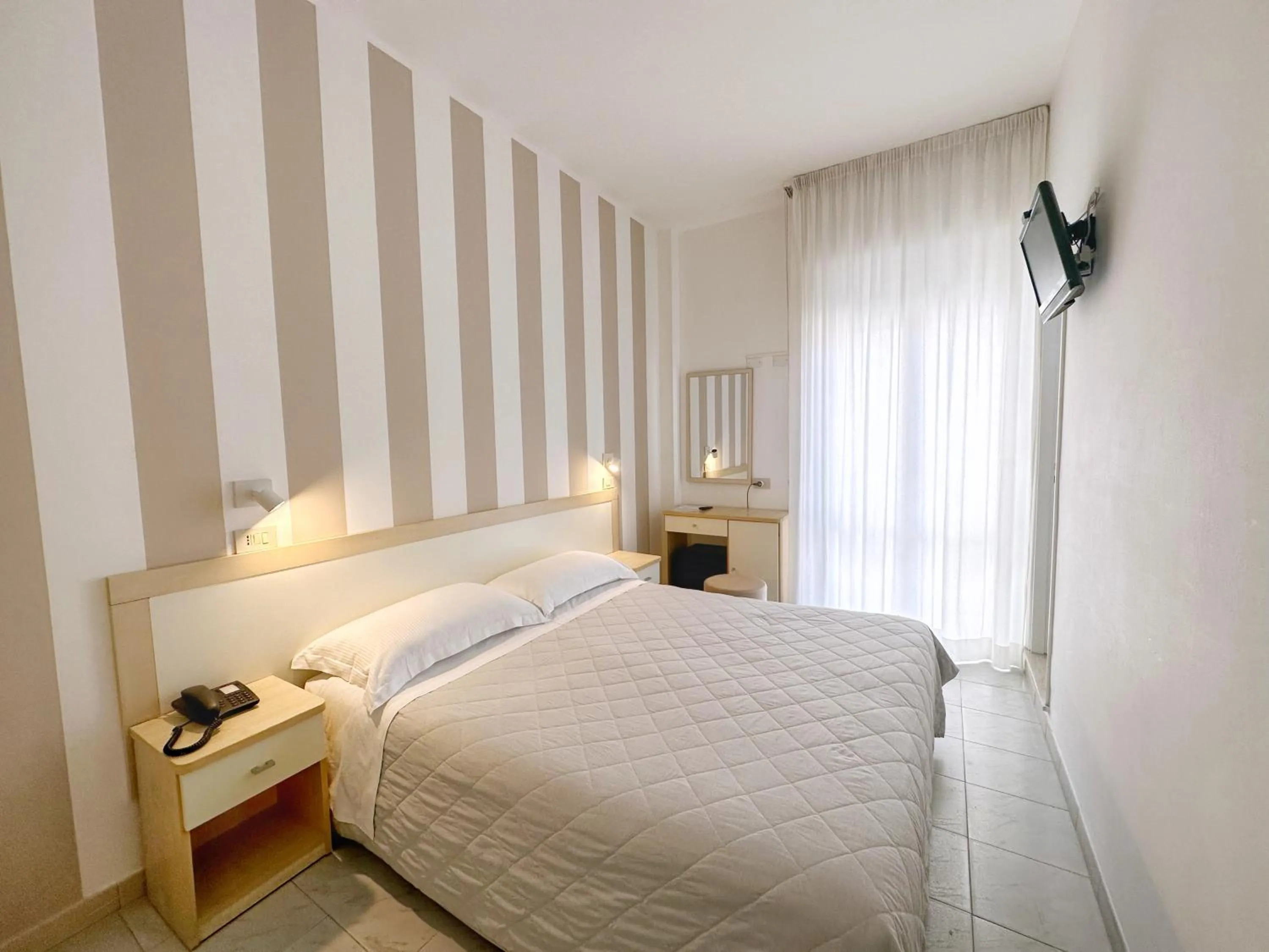 Photo of the whole room, Bed in Aura Living Hotel