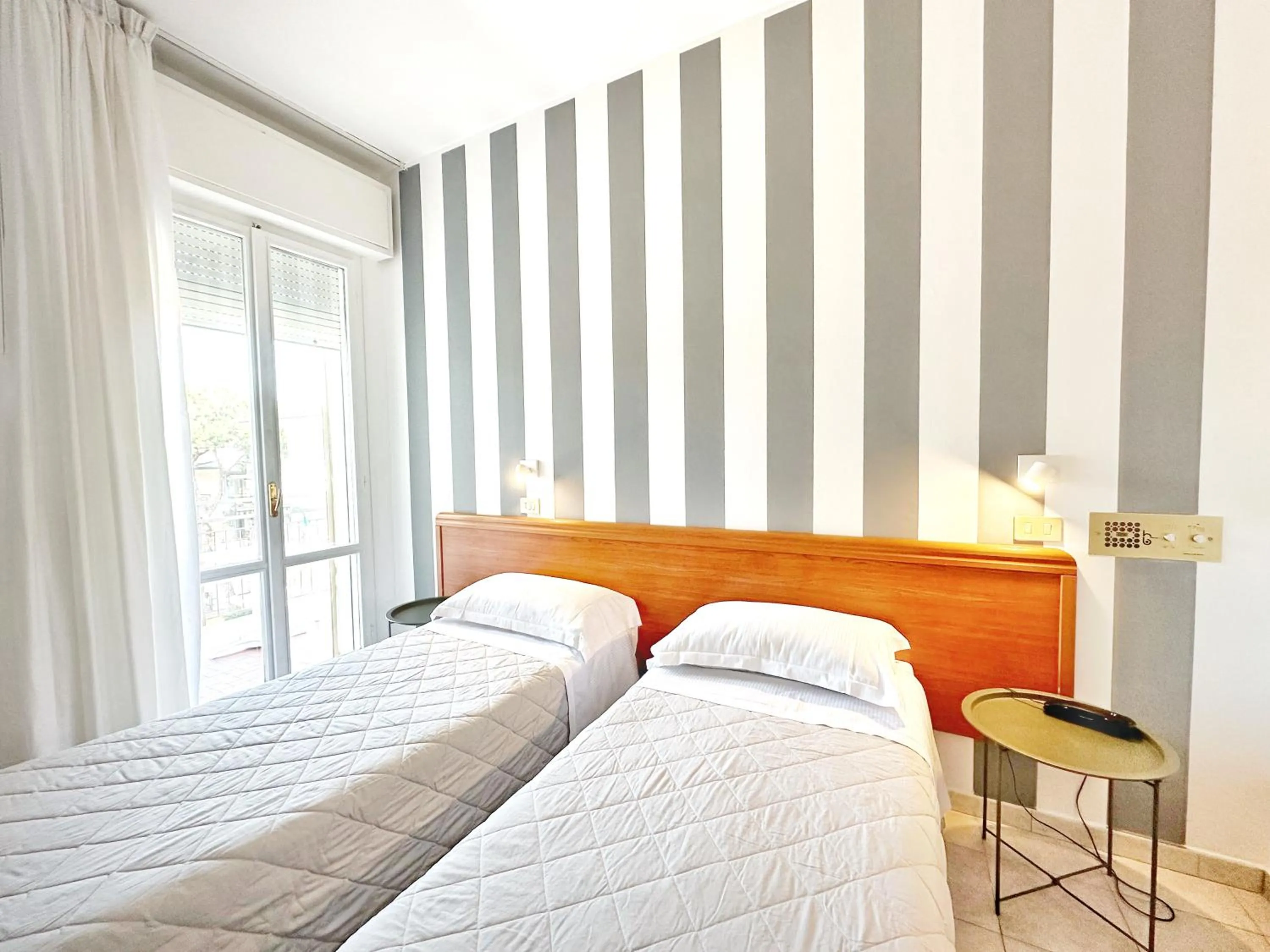 Bed in Aura Living Hotel