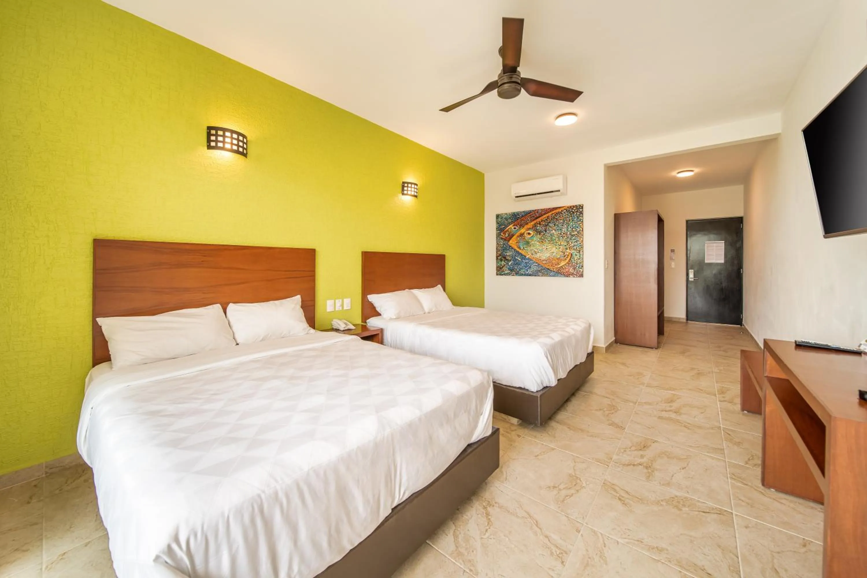 Communal lounge/ TV room, Bed in Villas Coral Huatulco