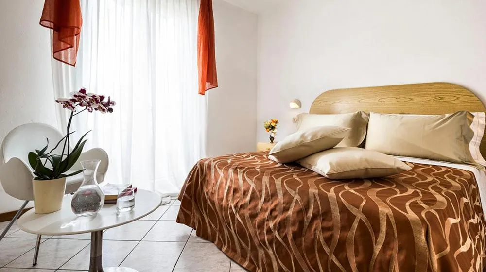 Bed in Hotel Capinera