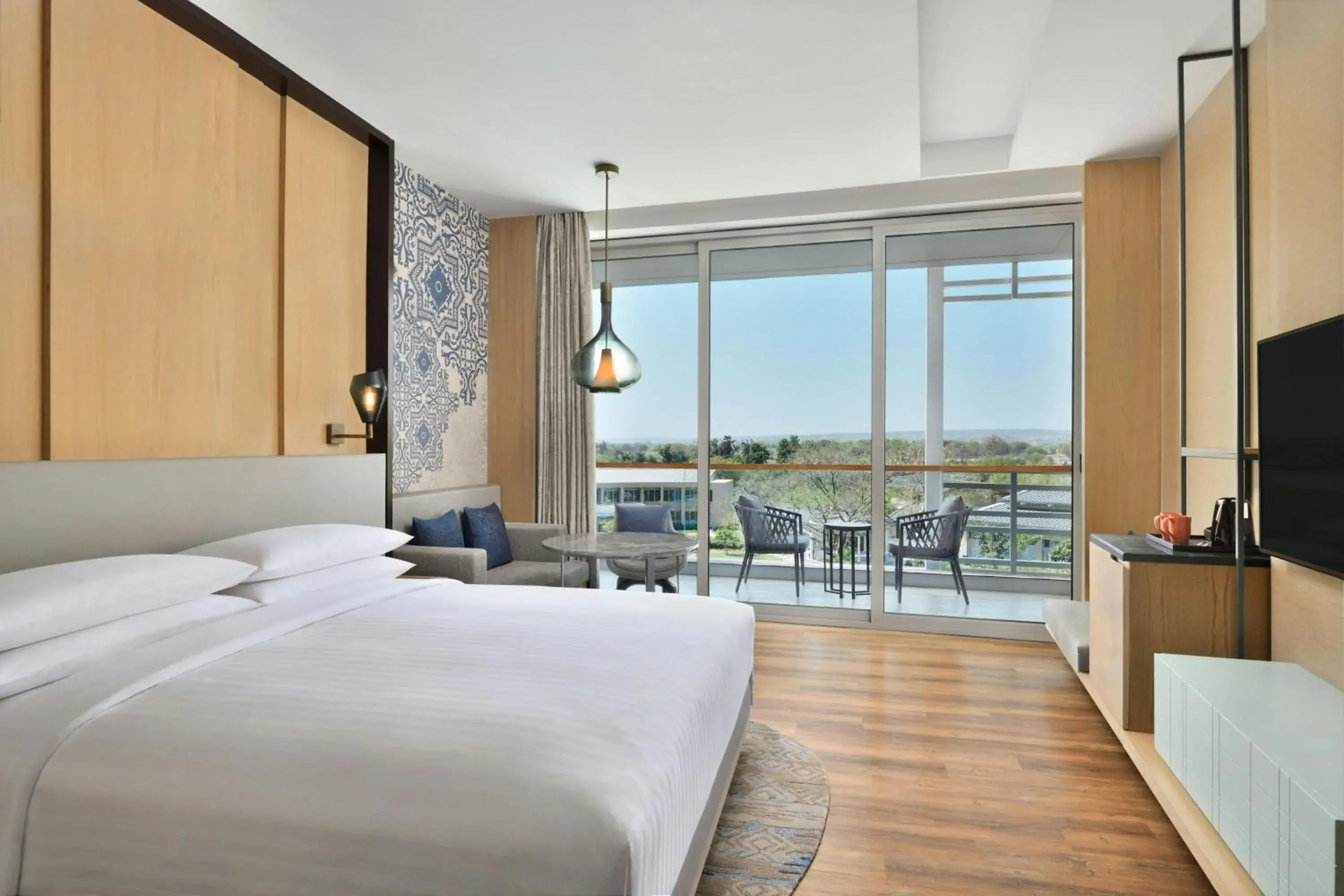 Deluxe Guest room, King, Pool view, Balcony in Courtyard by Marriott Aravali Resort Deluxe Guest room, King, Pool view, Balcony in Courtyard by Marriott Aravali Resort