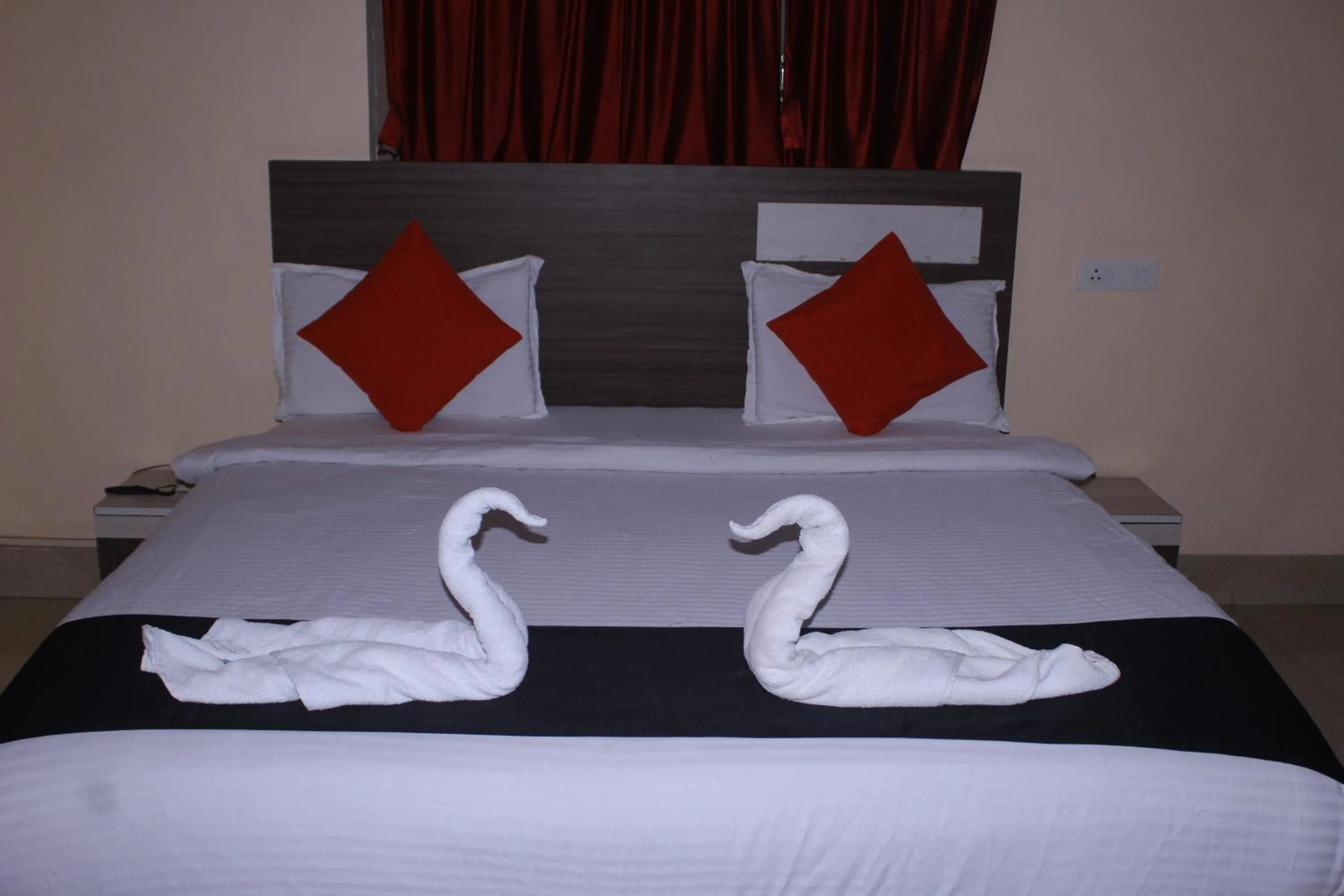 Bed in CHETAN INN HOTEL