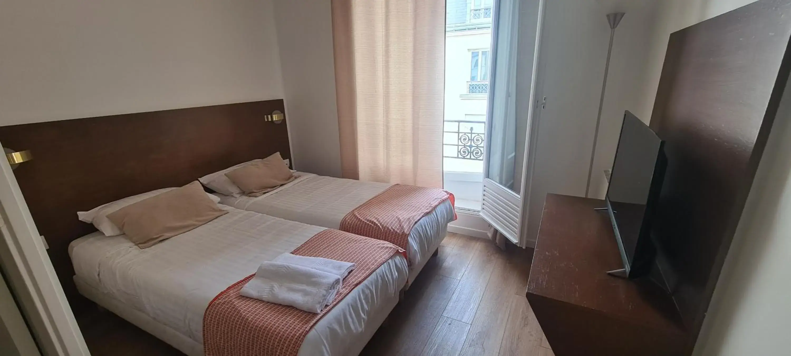 Bed in Dupleix Hotel Bed in Dupleix Hotel