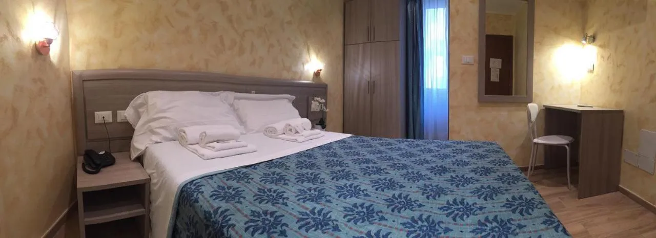 Bed in Hotel Orchidea