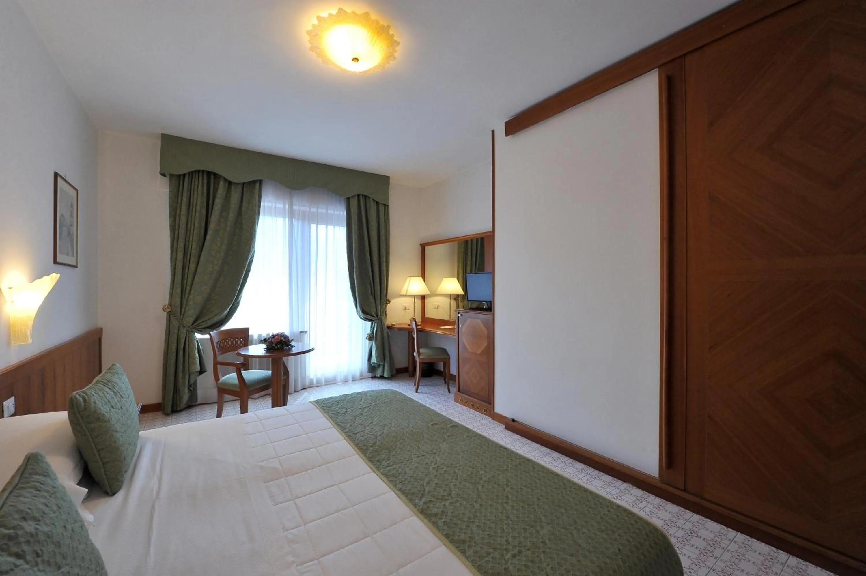 Photo of the whole room, Bed in Grand Hotel Cesare Augusto