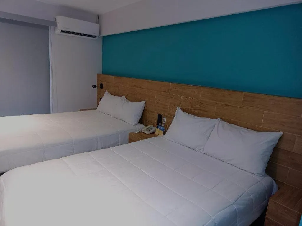 Bed in Hotel Kavia Mazatlán