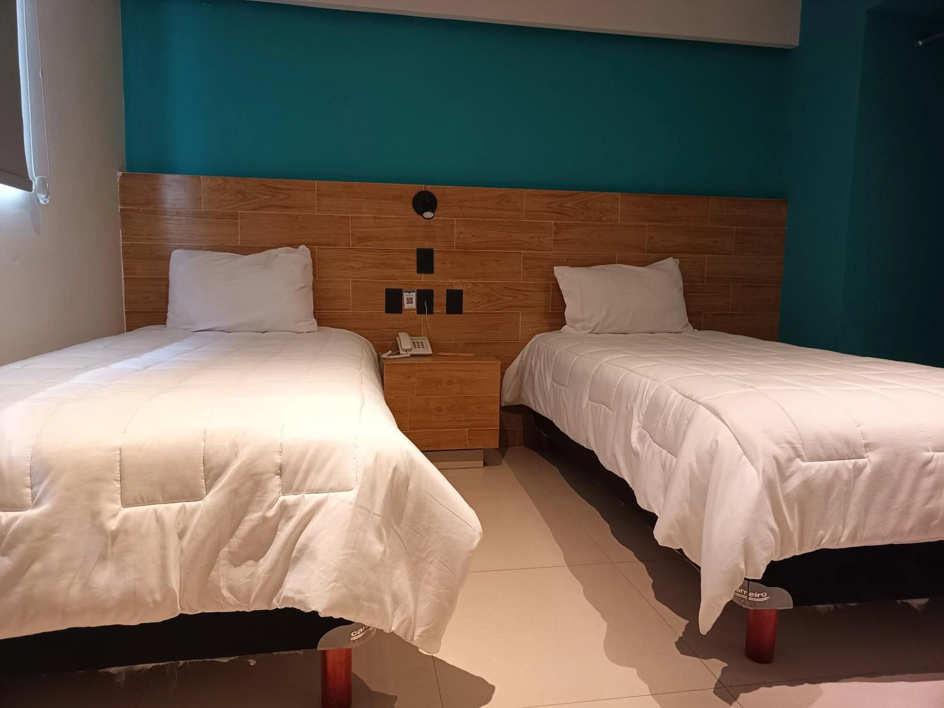 Bed in Hotel Kavia Mazatlán