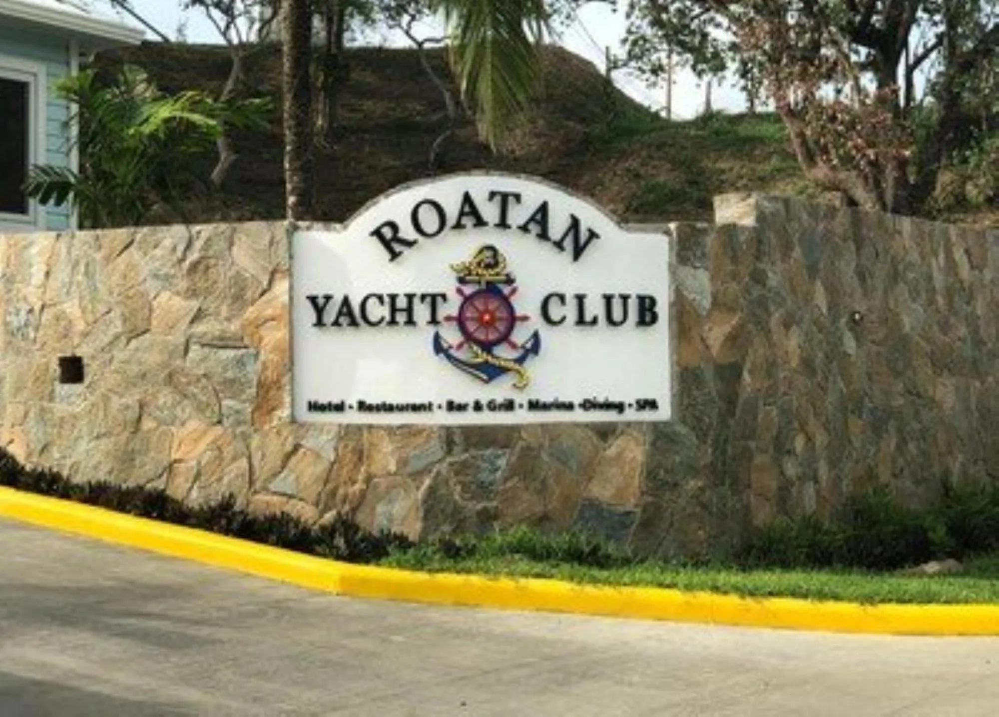 Property logo or sign in Hotel and Dive Center Roatan Yacht Club