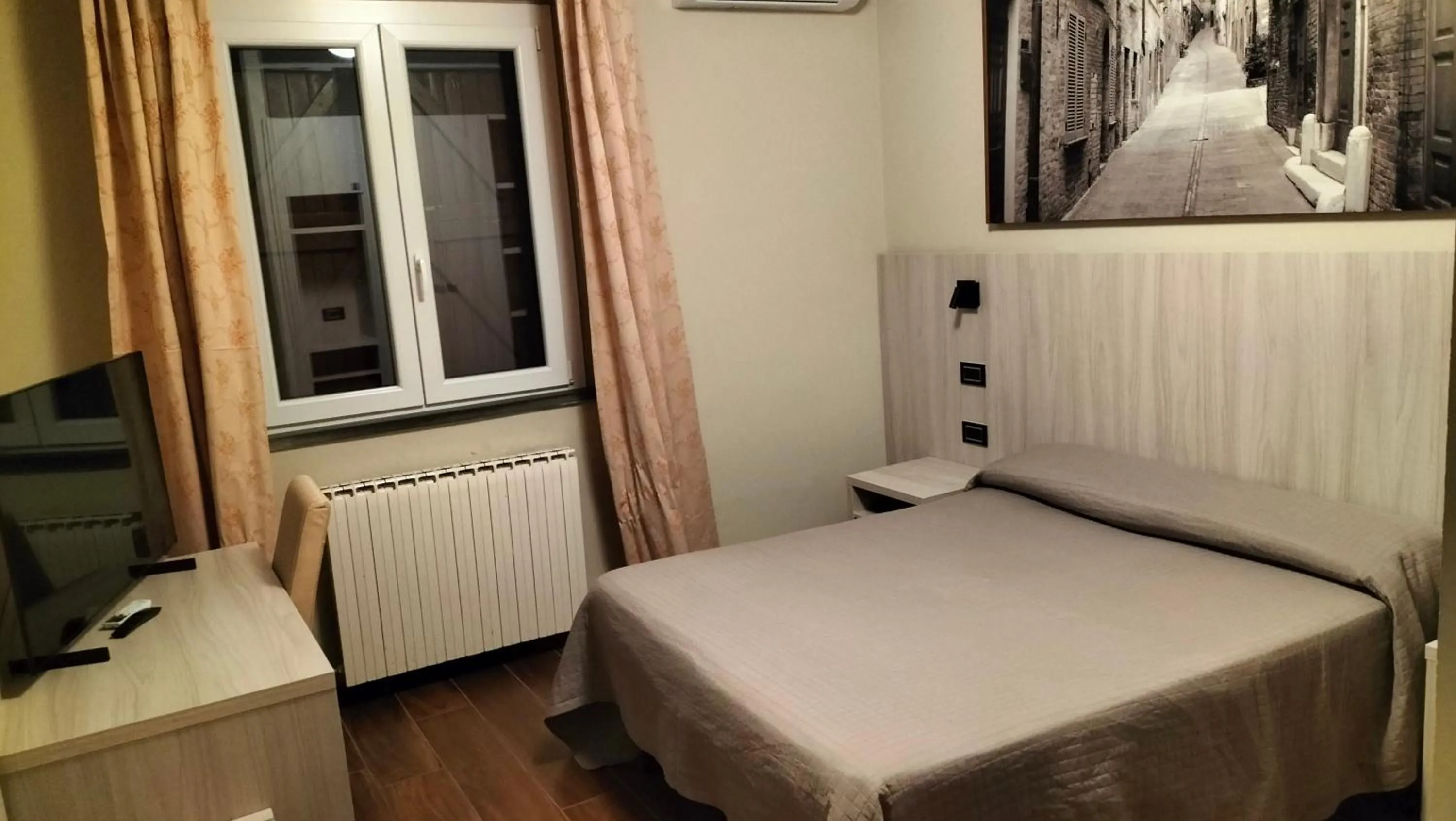 Bed in Hotel La Meridiana