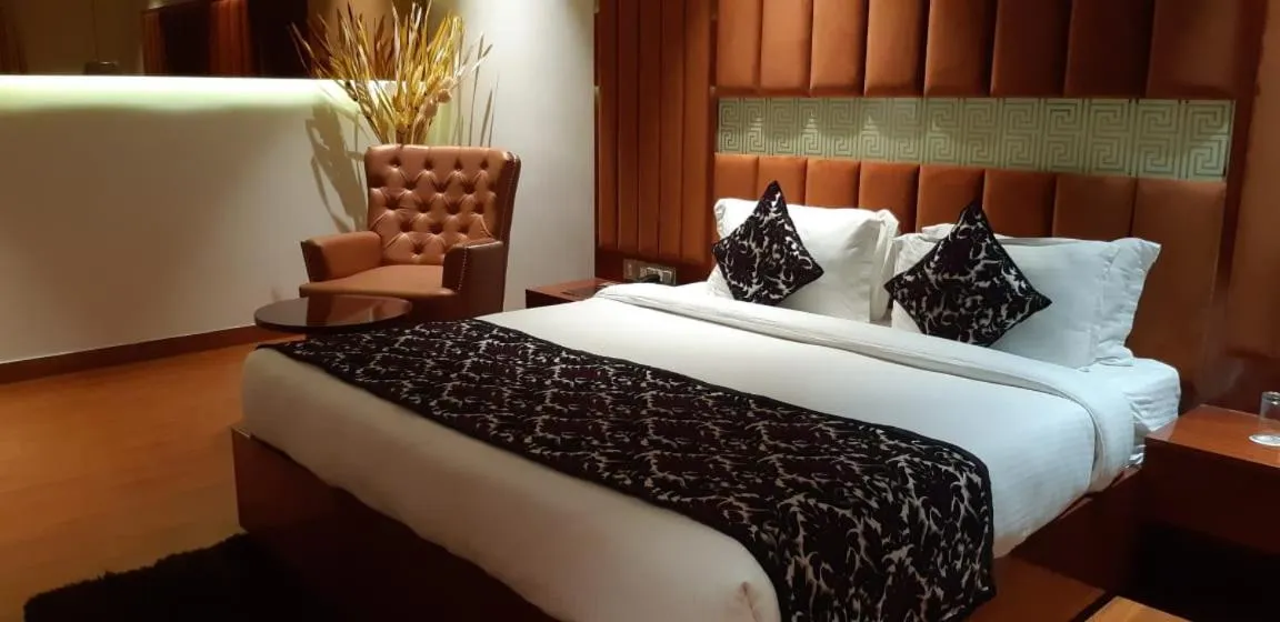 Bed in Grand Geet Hotels