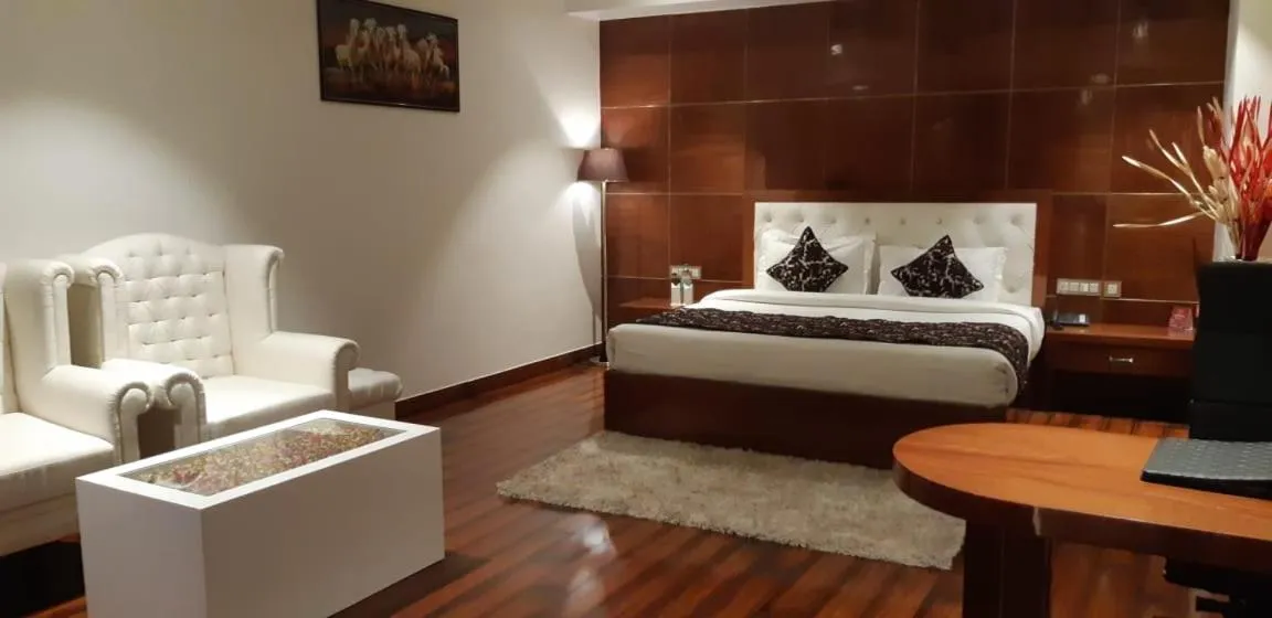 Bed in Grand Geet Hotels