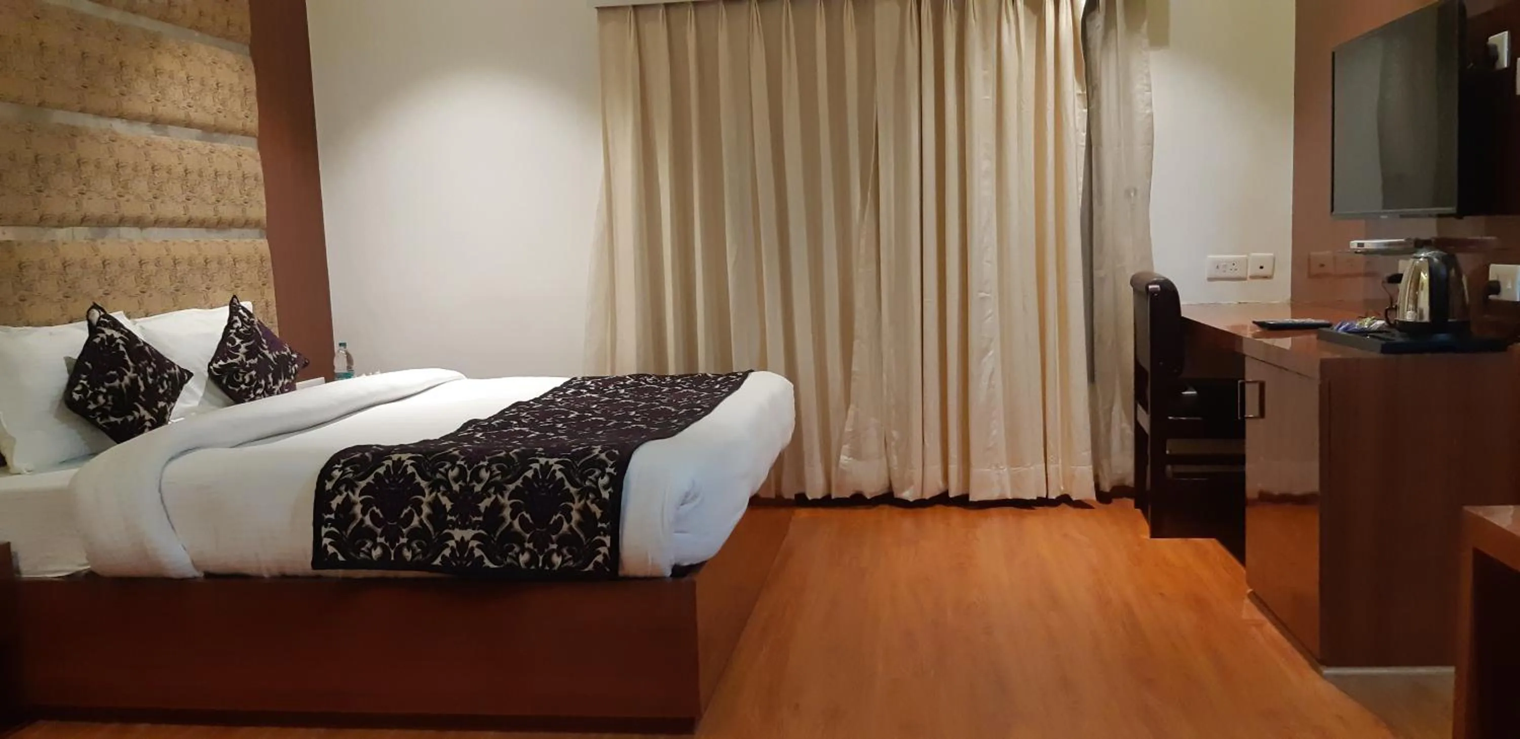 Bed in Grand Geet Hotels