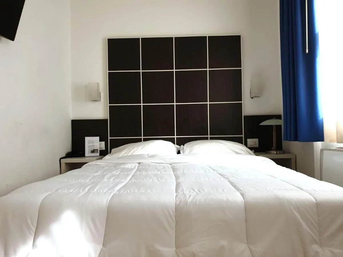 Bed in Hotel Vitruvio