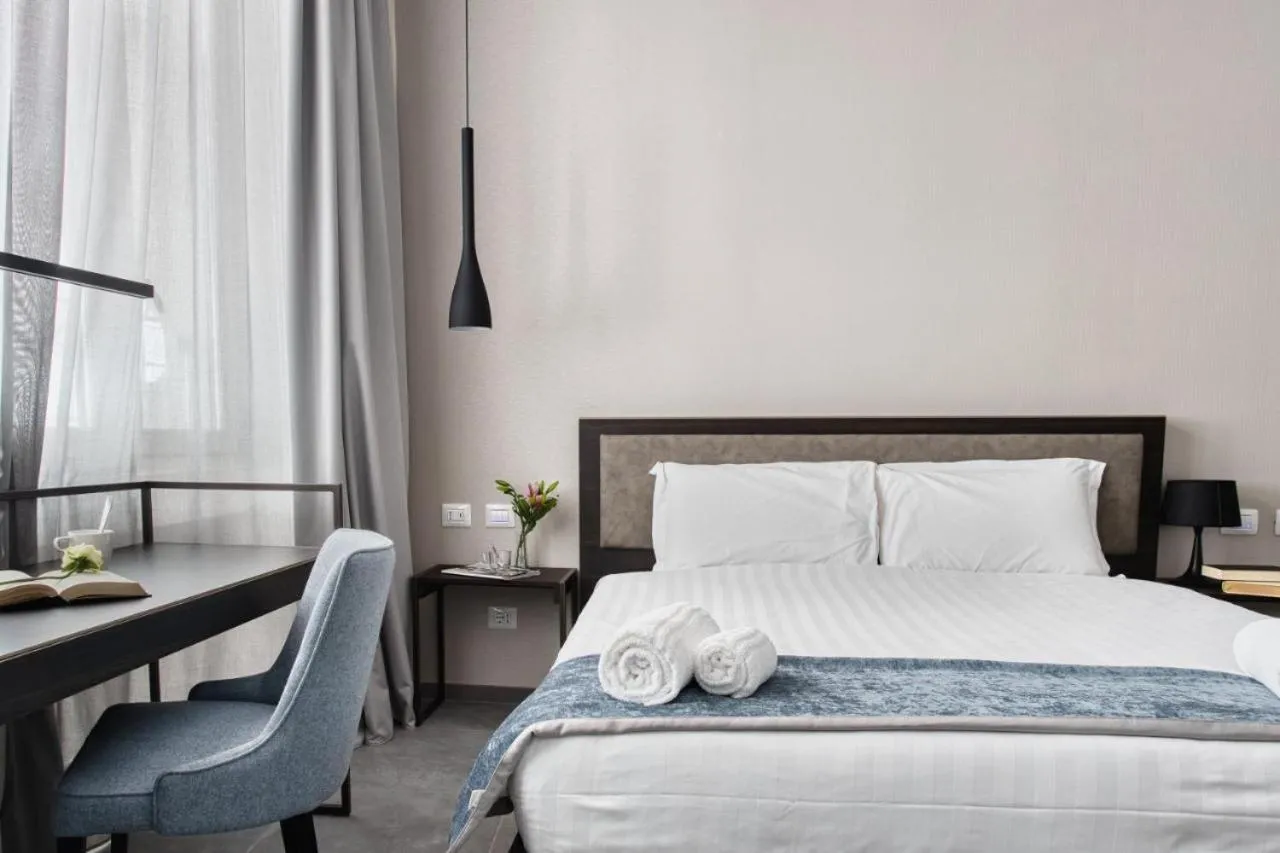 Bed in Hotel Vitruvio