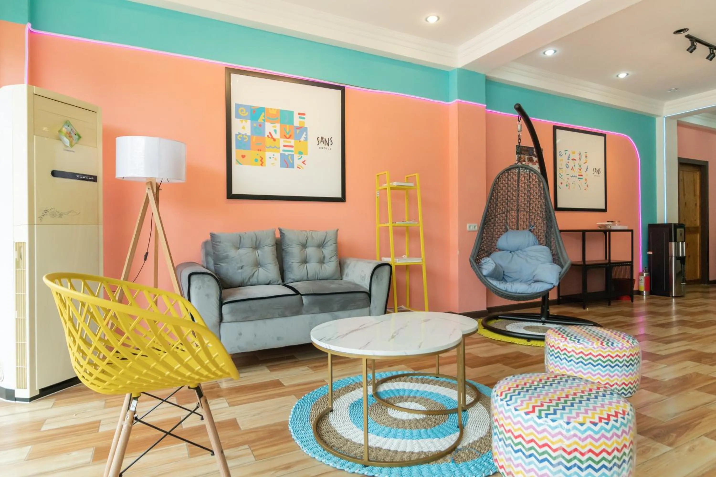 Seating area in Sans Hotel Beauty Palembang