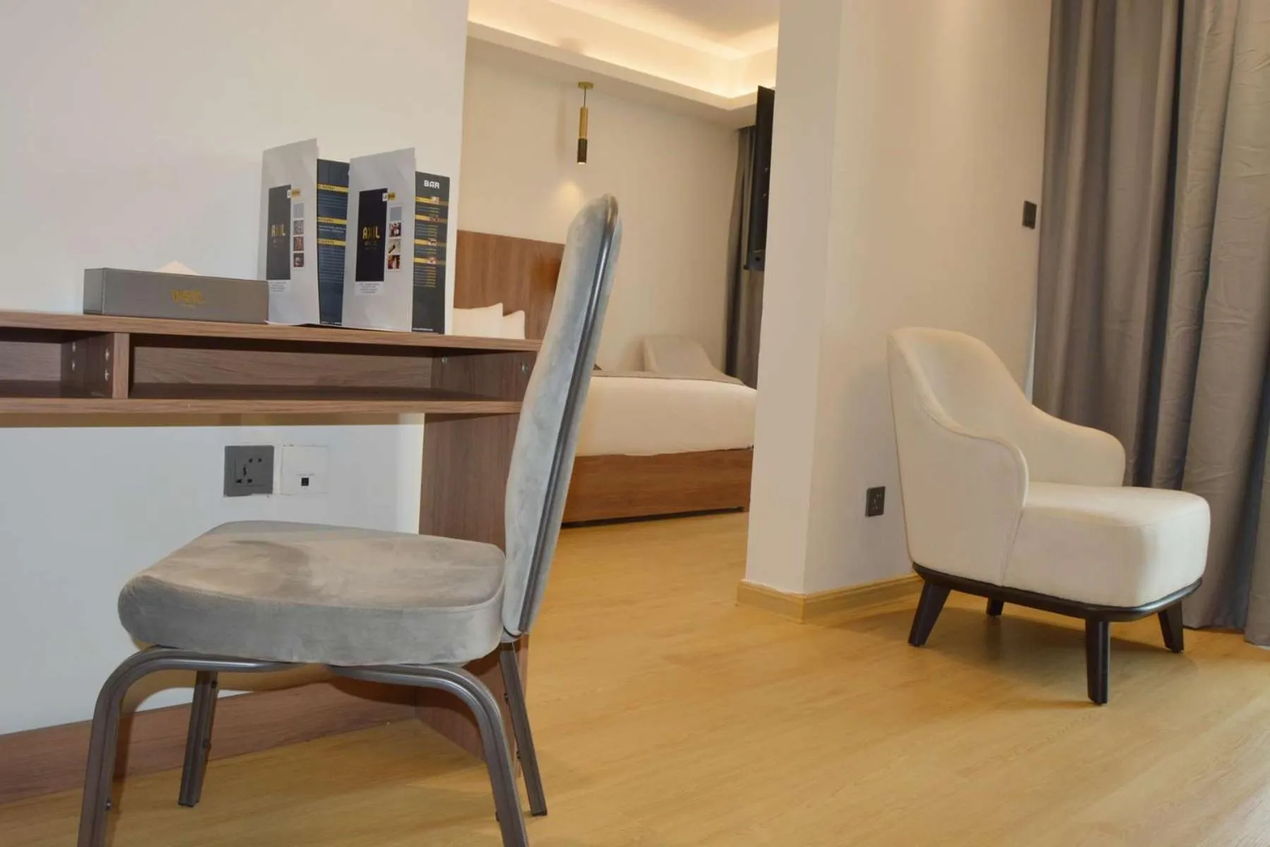 Seating area, Bed in AXIL HÔTEL