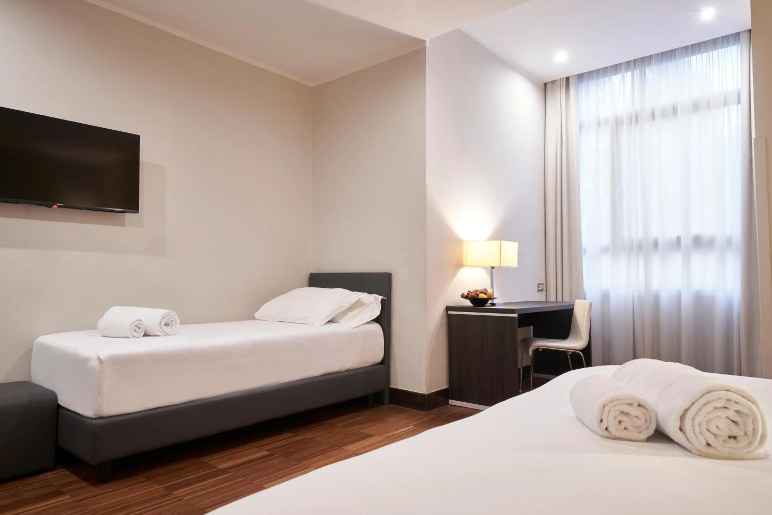 Bed in Hotel Leonardo da Vinci