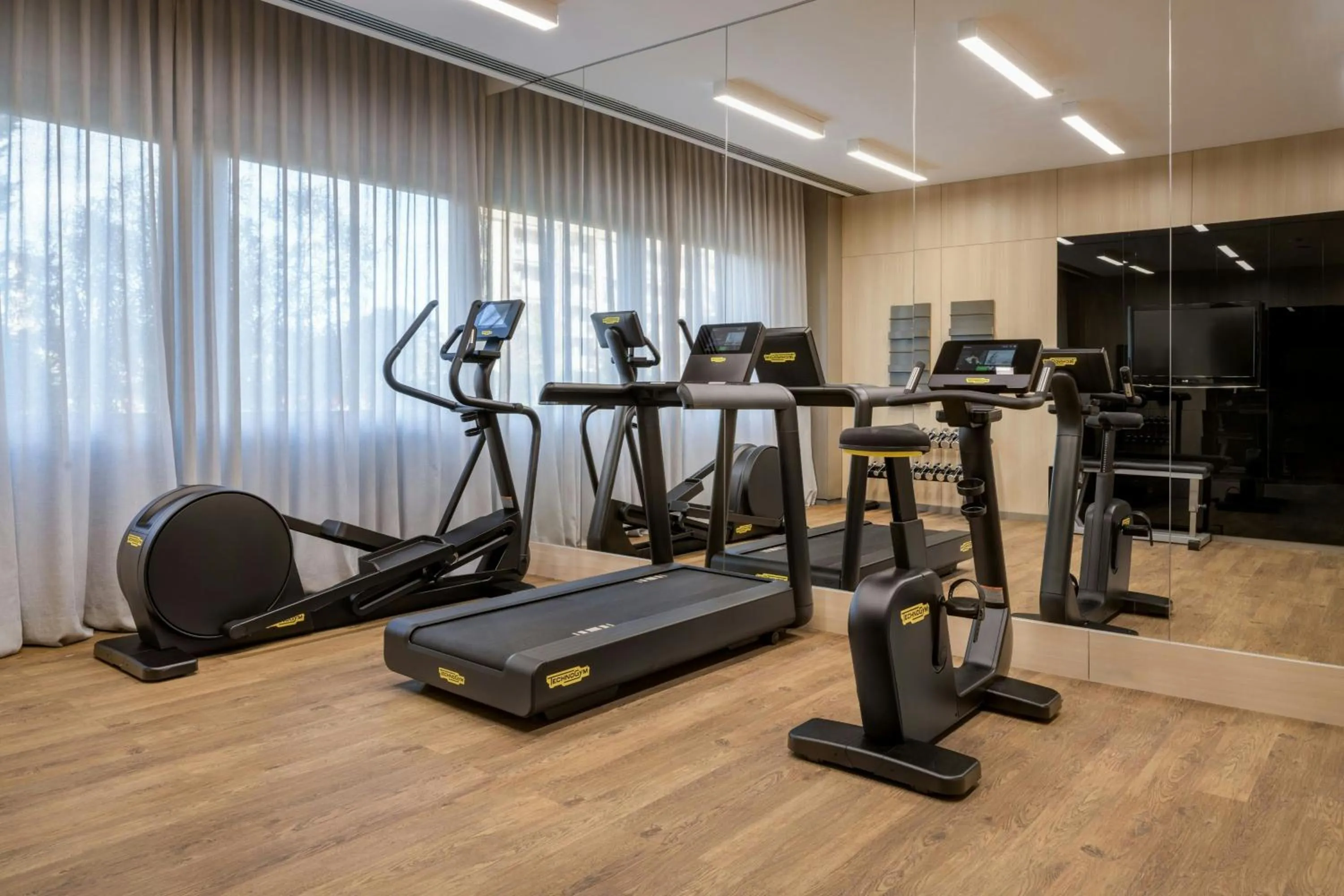 Fitness centre/facilities in AC Hotel by Marriott Pisa