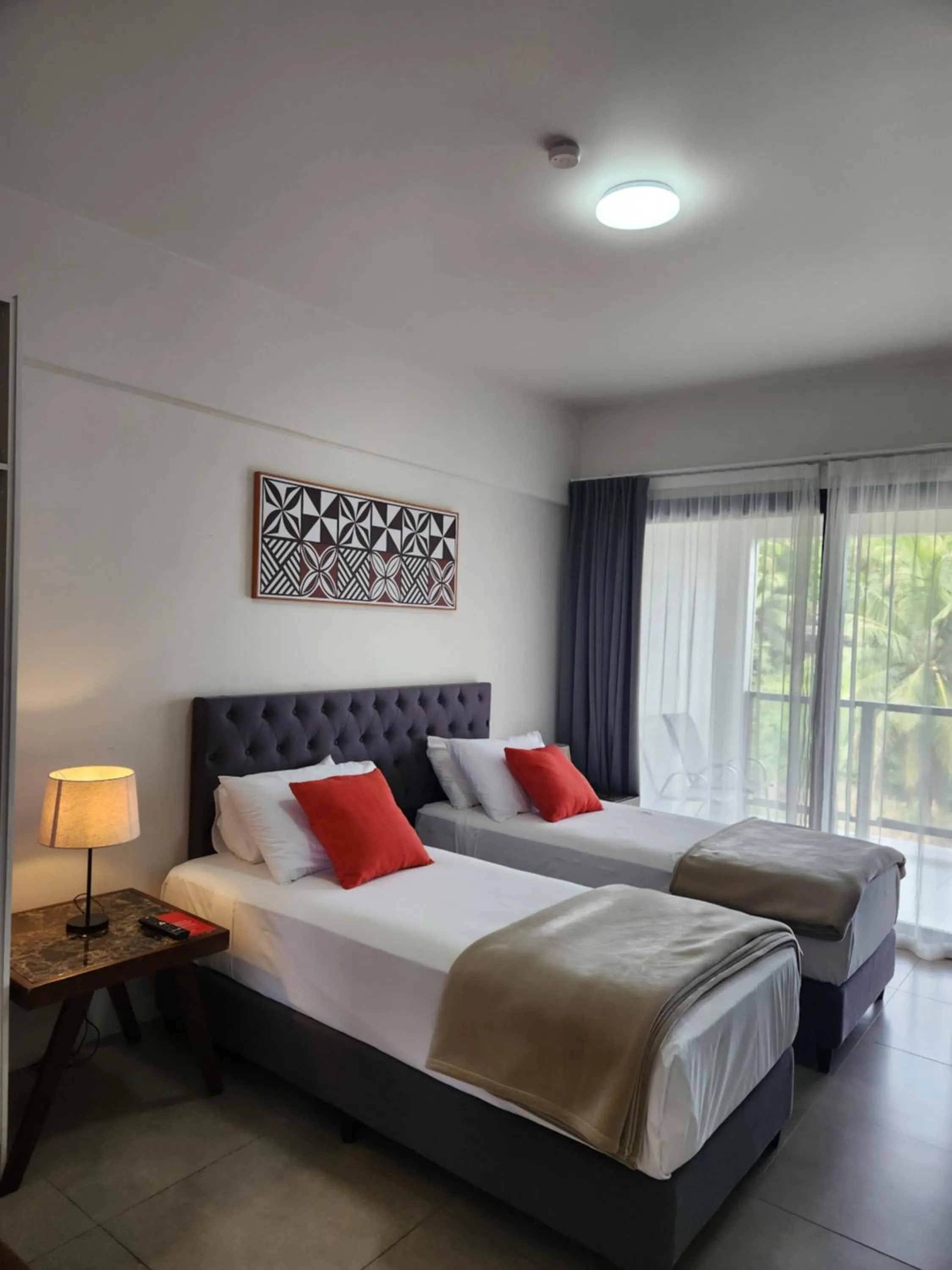 Bed in Ramada Suites By Wyndham Seafront Coral Coast