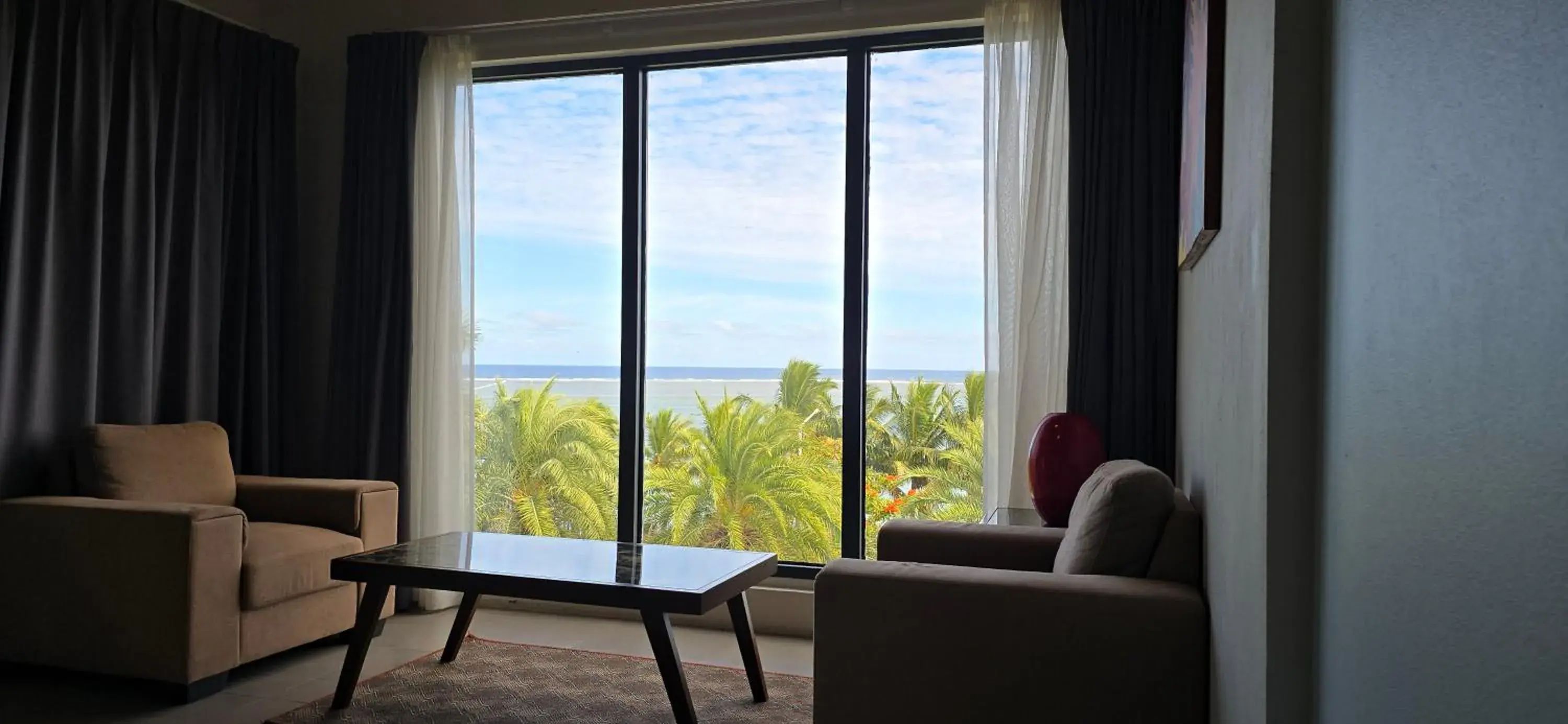 Living room in Ramada Suites By Wyndham Seafront Coral Coast Living room in Ramada Suites By Wyndham Seafront Coral Coast