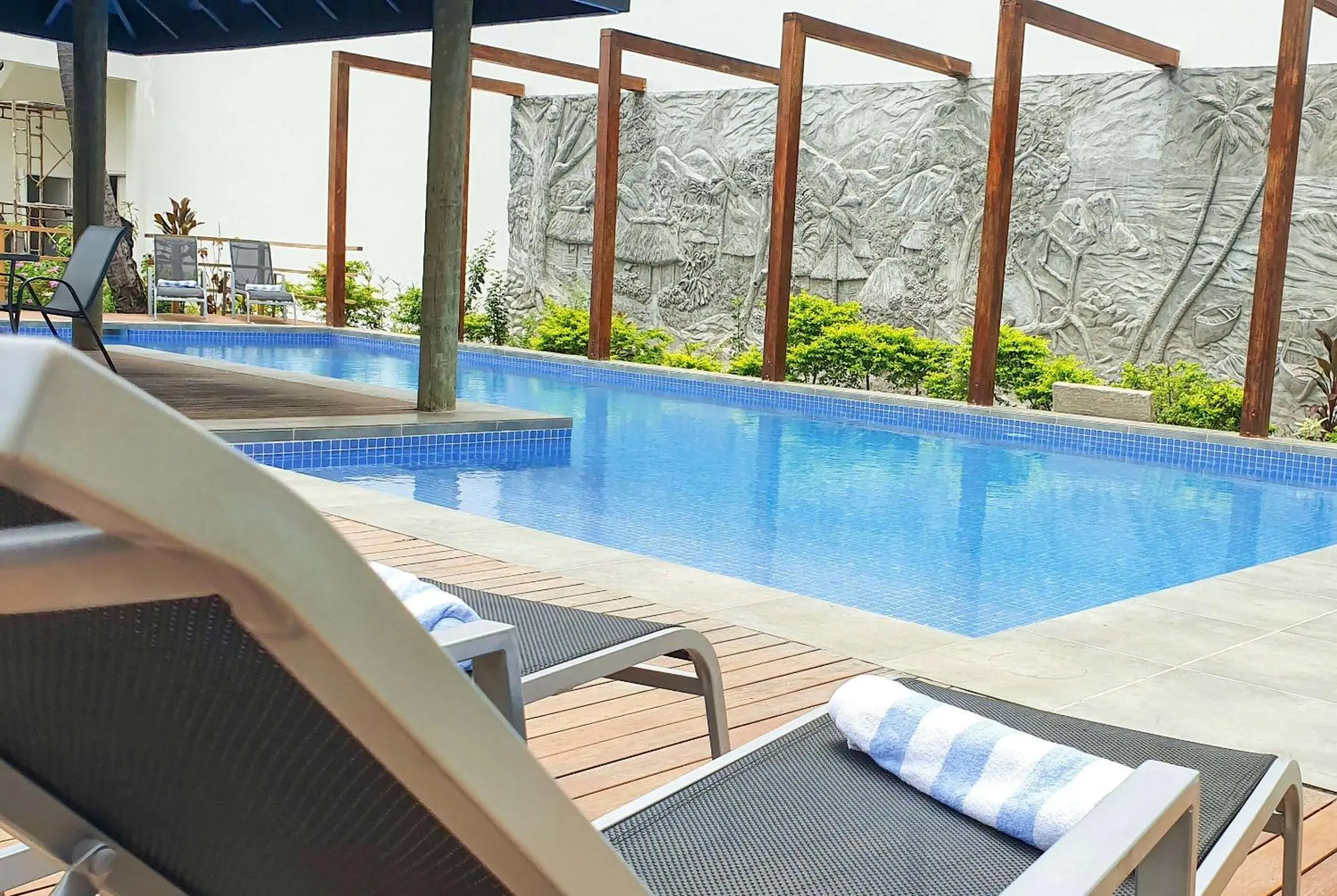 Pool view in Ramada Suites By Wyndham Seafront Coral Coast Pool view in Ramada Suites By Wyndham Seafront Coral Coast